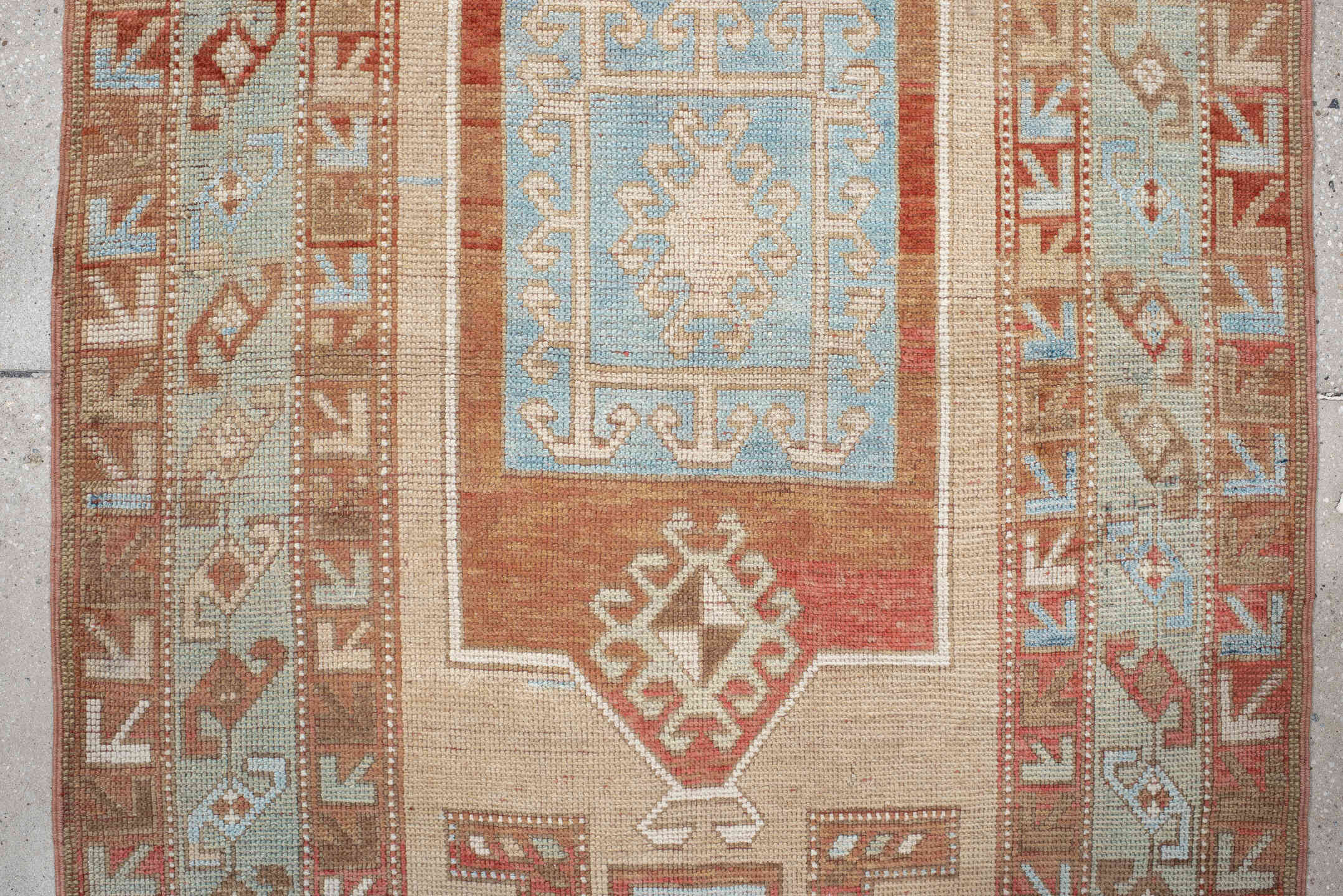 3' x 6' one-of-a-kind handmade vintage Caucasian small size rug. Color palette: ivory, rust, sky blue, camel, taupe