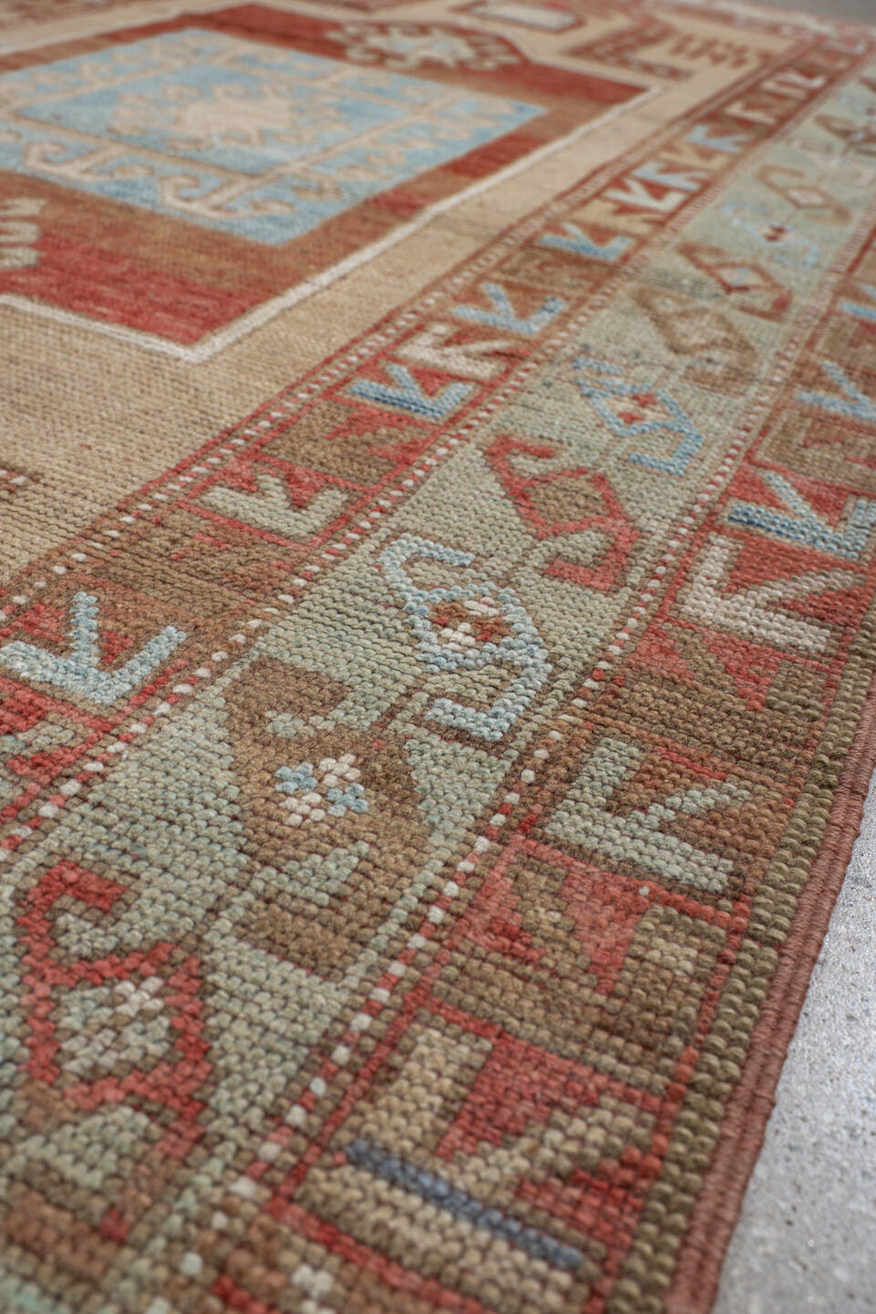 3' x 6' one-of-a-kind handmade vintage Caucasian small size rug. Color palette: ivory, rust, sky blue, camel, taupe