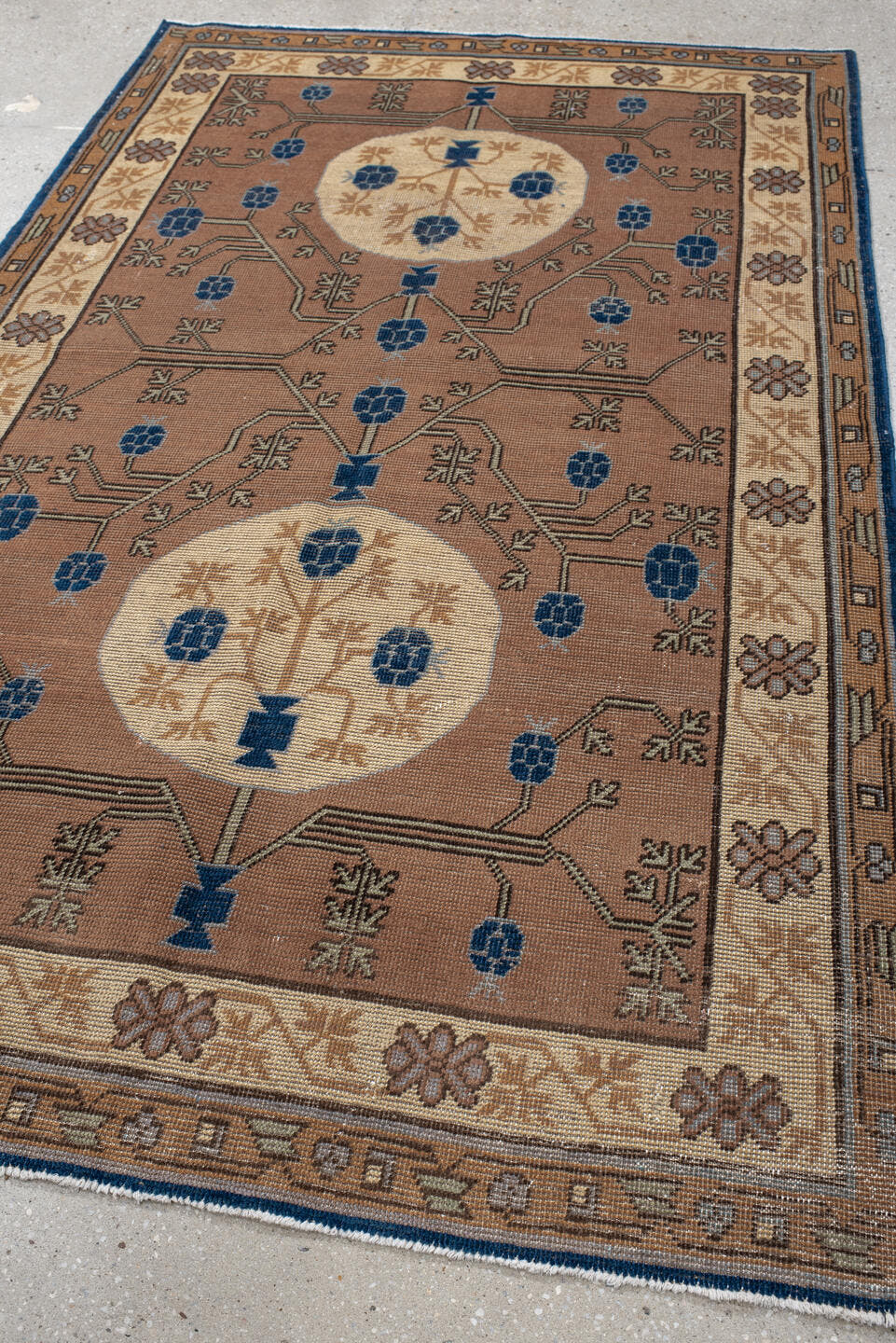 4' x 6' one-of-a-kind handmade vintage Khotan small size rug. Color palette: camel, ivory, indigo, taupe, brown, slate
