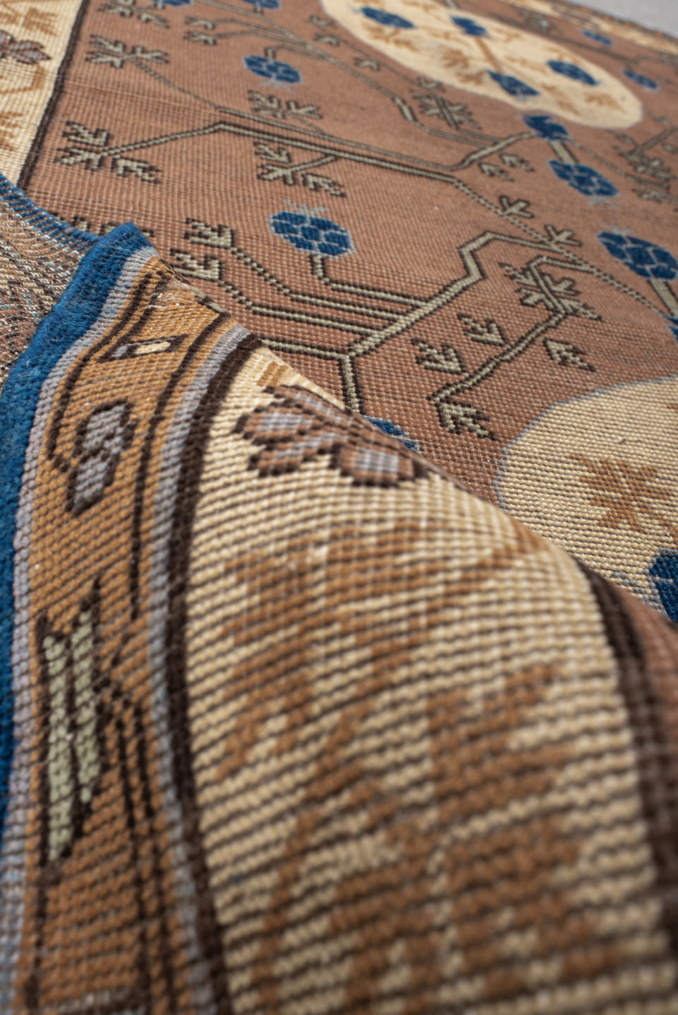 4' x 6' one-of-a-kind handmade vintage Khotan small size rug. Color palette: camel, ivory, indigo, taupe, brown, slate