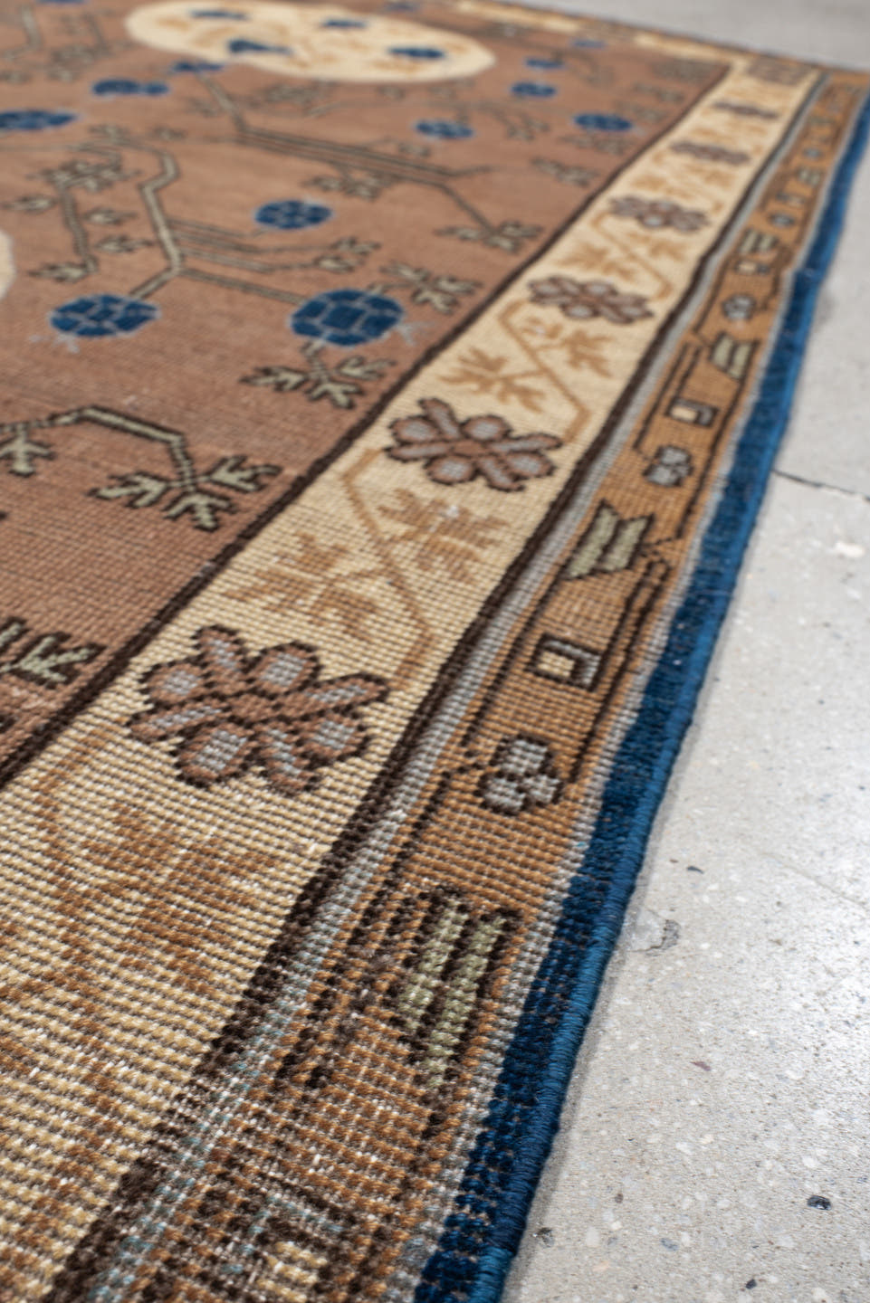 4' x 6' one-of-a-kind handmade vintage Khotan small size rug. Color palette: camel, ivory, indigo, taupe, brown, slate