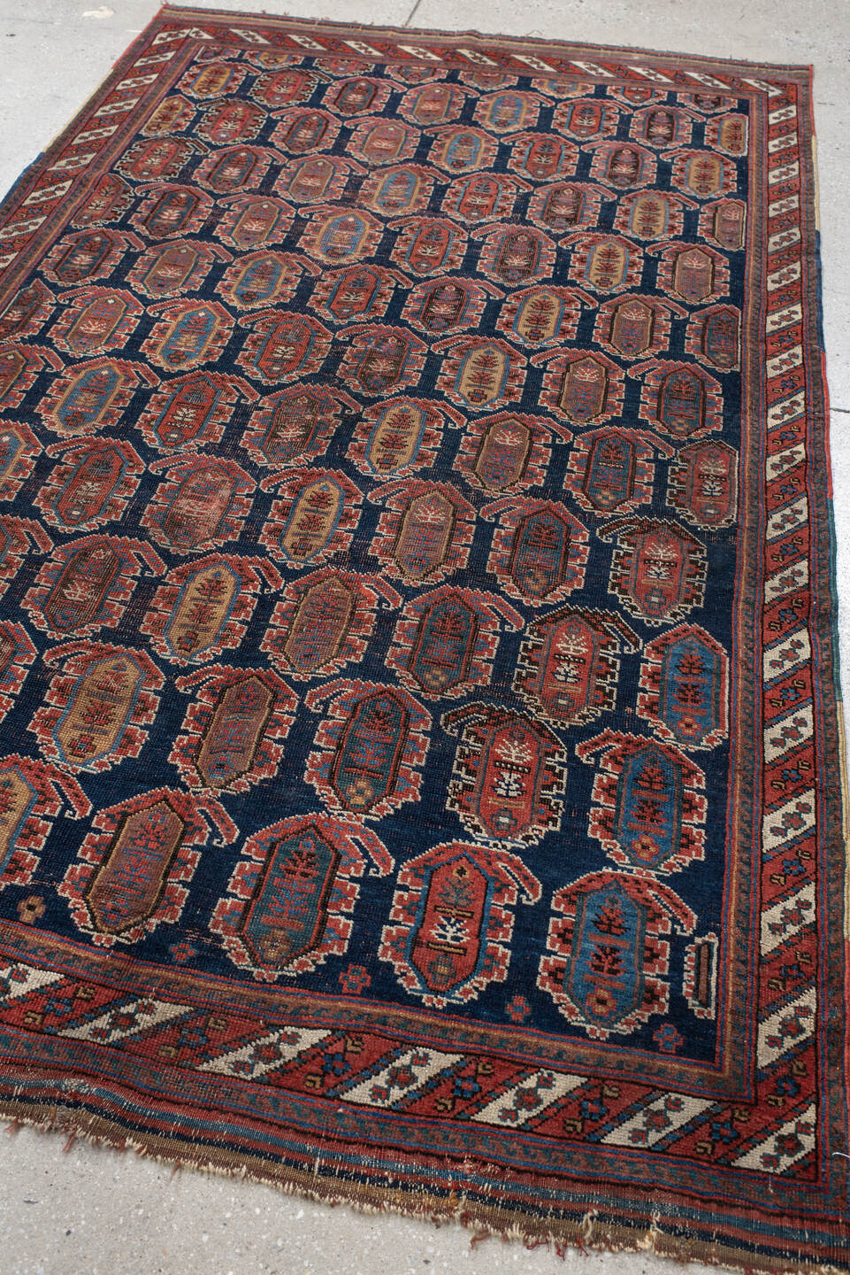4' x 7' one-of-a-kind handmade vintage Afshar rug. Color palette: navy, rust, ivory, sky_blue, camel, slate, terracotta