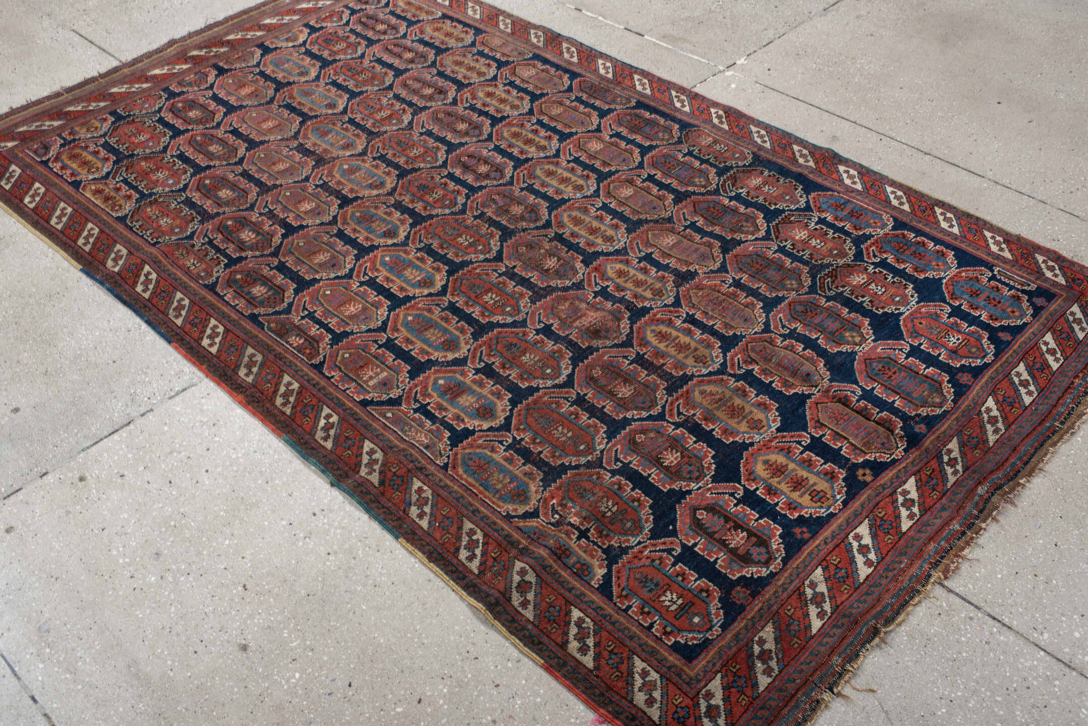 4' x 7' one-of-a-kind handmade vintage Afshar rug. Color palette: navy, rust, ivory, sky_blue, camel, slate, terracotta