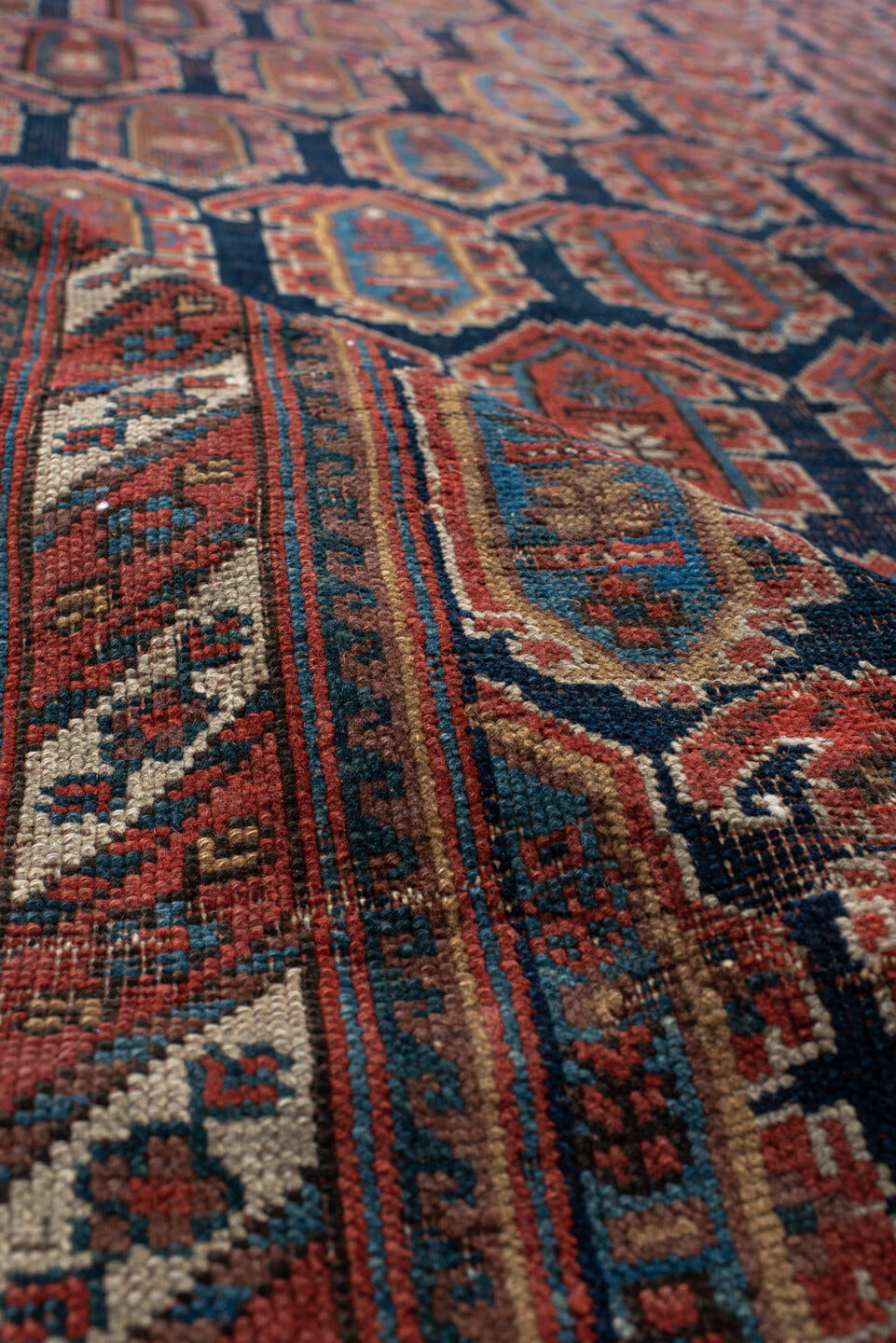 4' x 7' one-of-a-kind handmade vintage Afshar rug. Color palette: navy, rust, ivory, sky_blue, camel, slate, terracotta