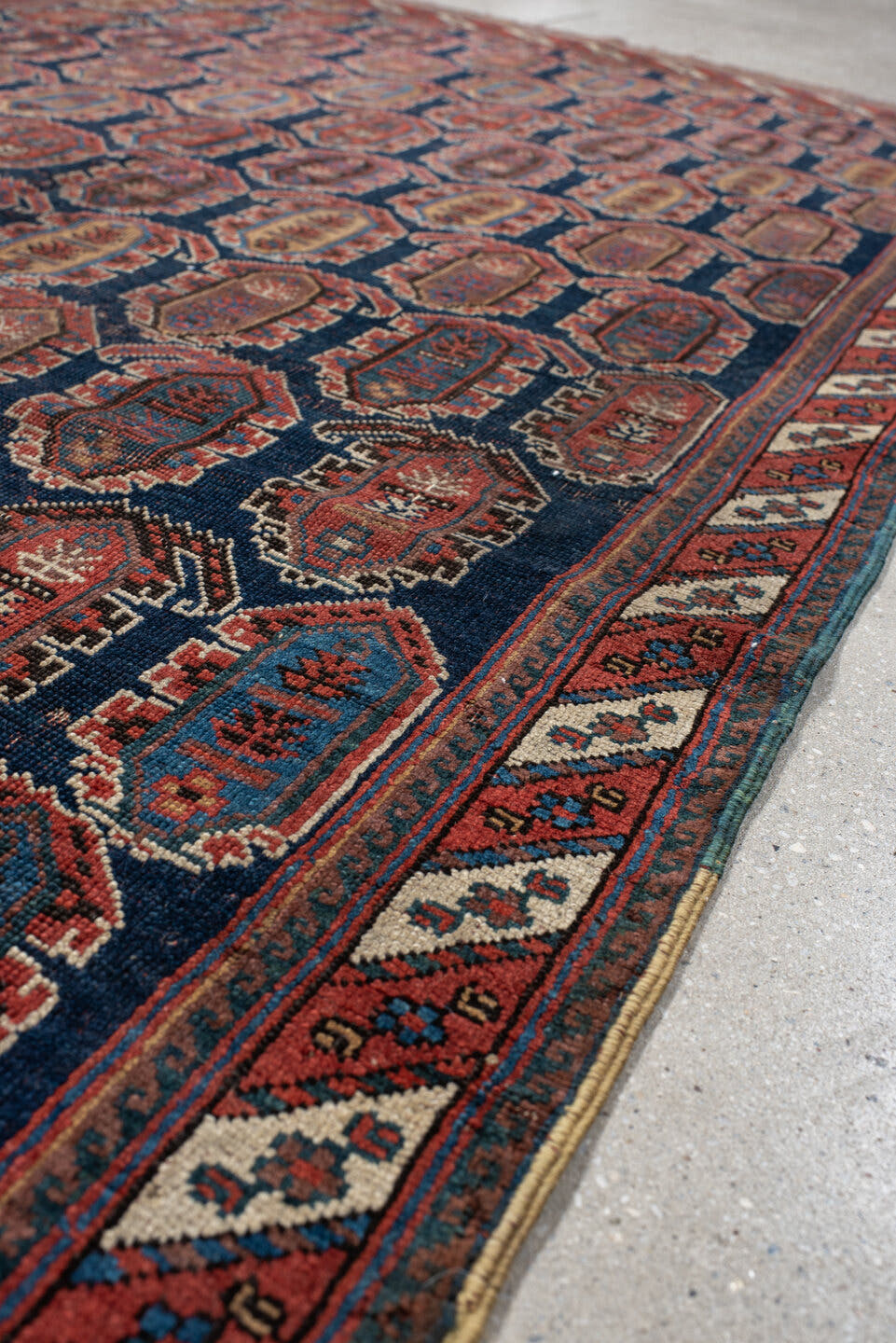 4' x 7' one-of-a-kind handmade vintage Afshar rug. Color palette: navy, rust, ivory, sky_blue, camel, slate, terracotta