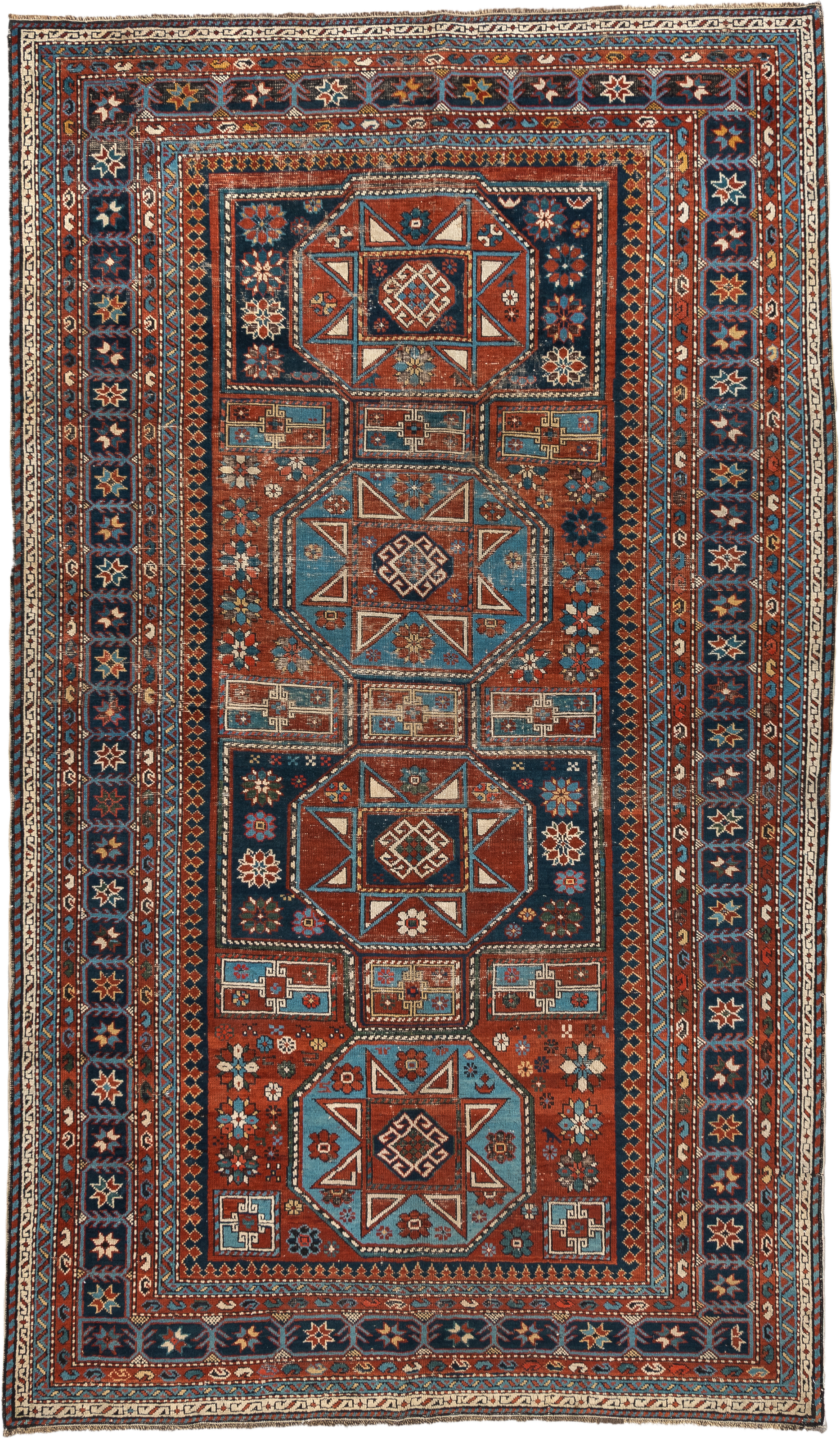 4' x 8' one-of-a-kind handmade vintage Shirvan rug. Color palette: rust, navy, sky blue, ivory, terra cotta, slate, cream