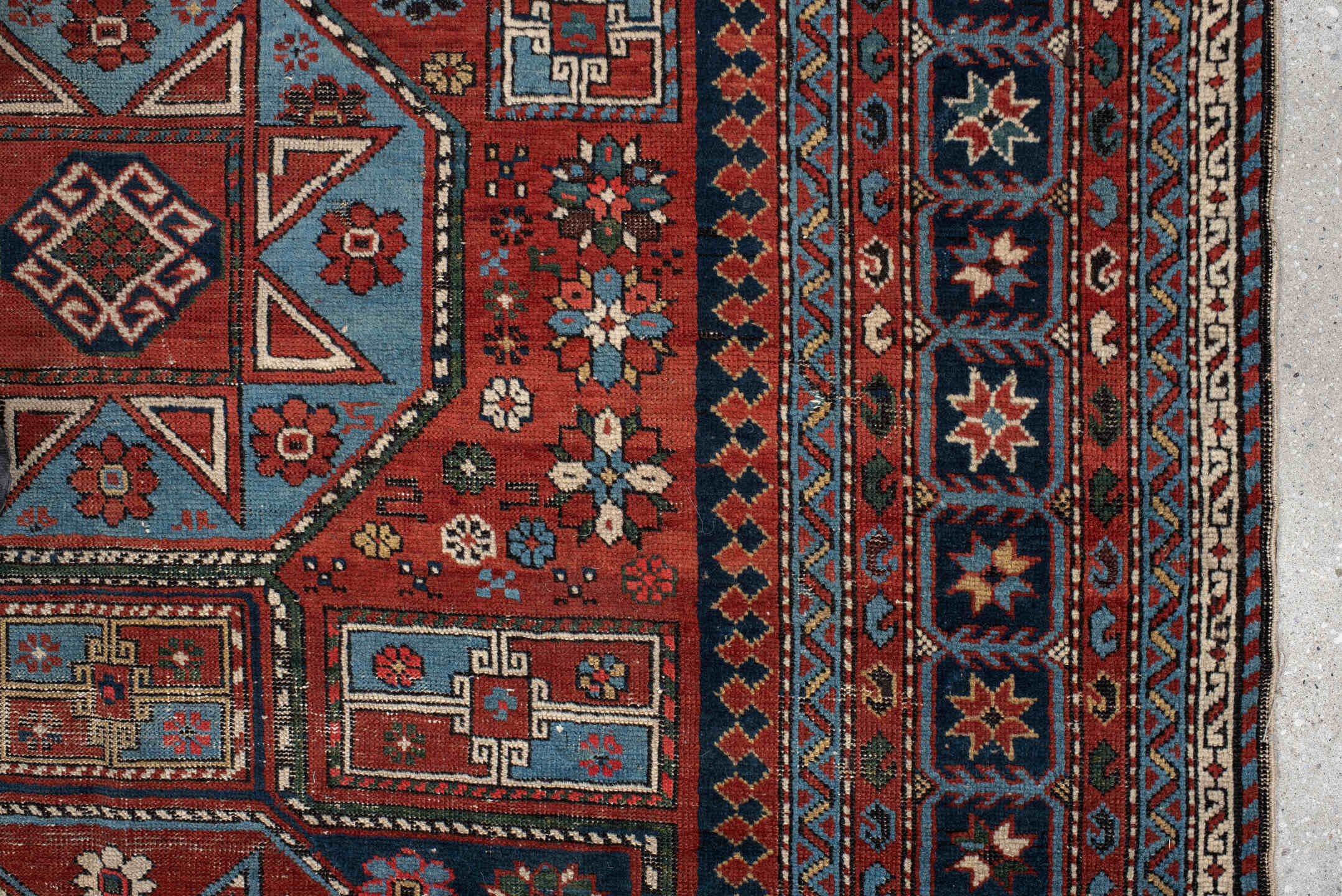 4' x 8' one-of-a-kind handmade vintage Shirvan rug. Color palette: rust, navy, sky blue, ivory, terra cotta, slate, cream