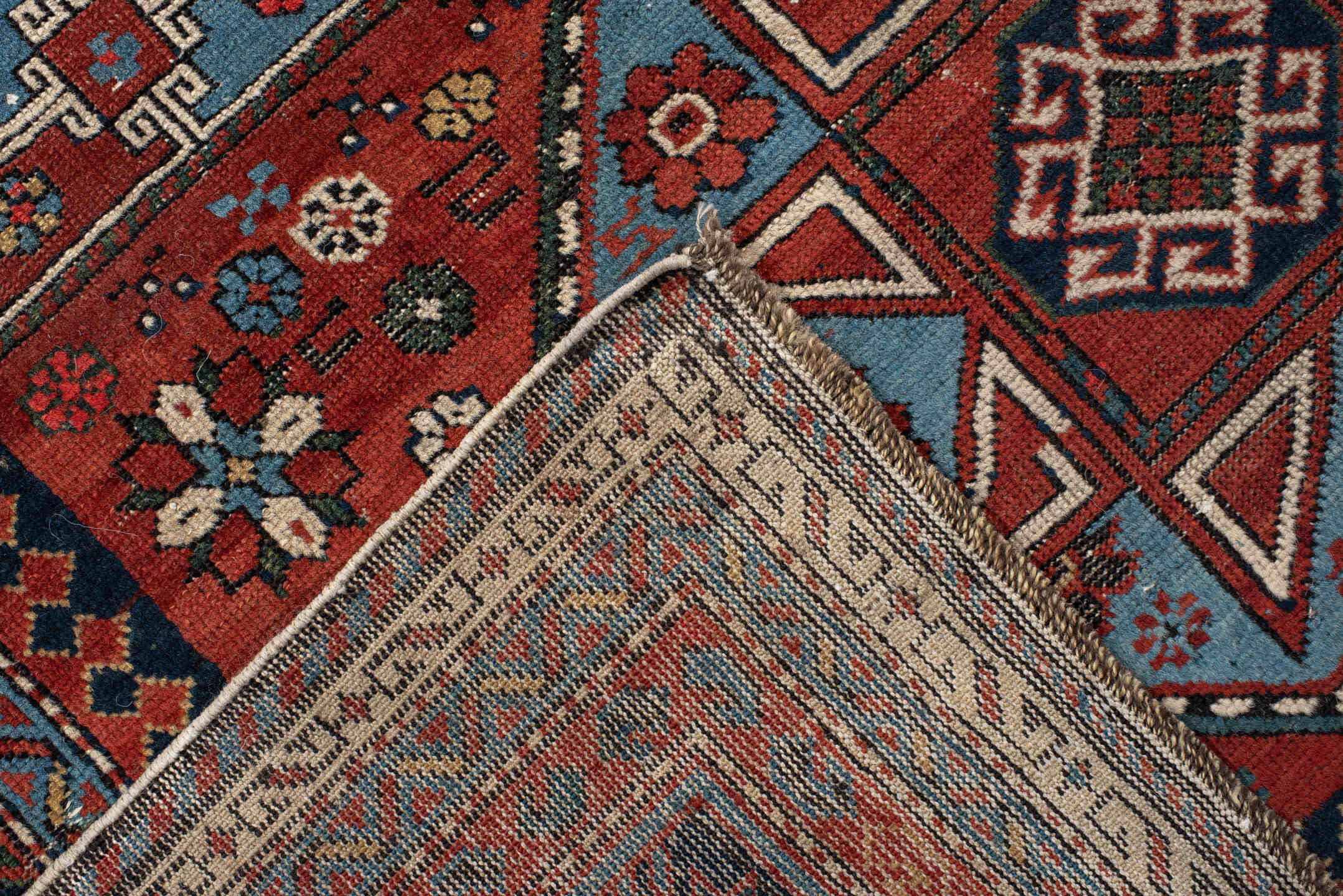 4' x 8' one-of-a-kind handmade vintage Shirvan rug. Color palette: rust, navy, sky blue, ivory, terra cotta, slate, cream