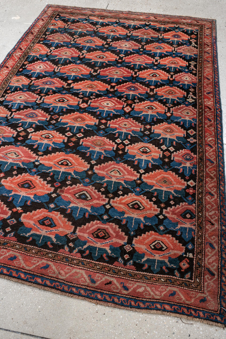 4' x 6' one-of-a-kind handmade vintage Caucasian small size rug. Color palette: rust, charcoal, teal, coral, ivory, navy