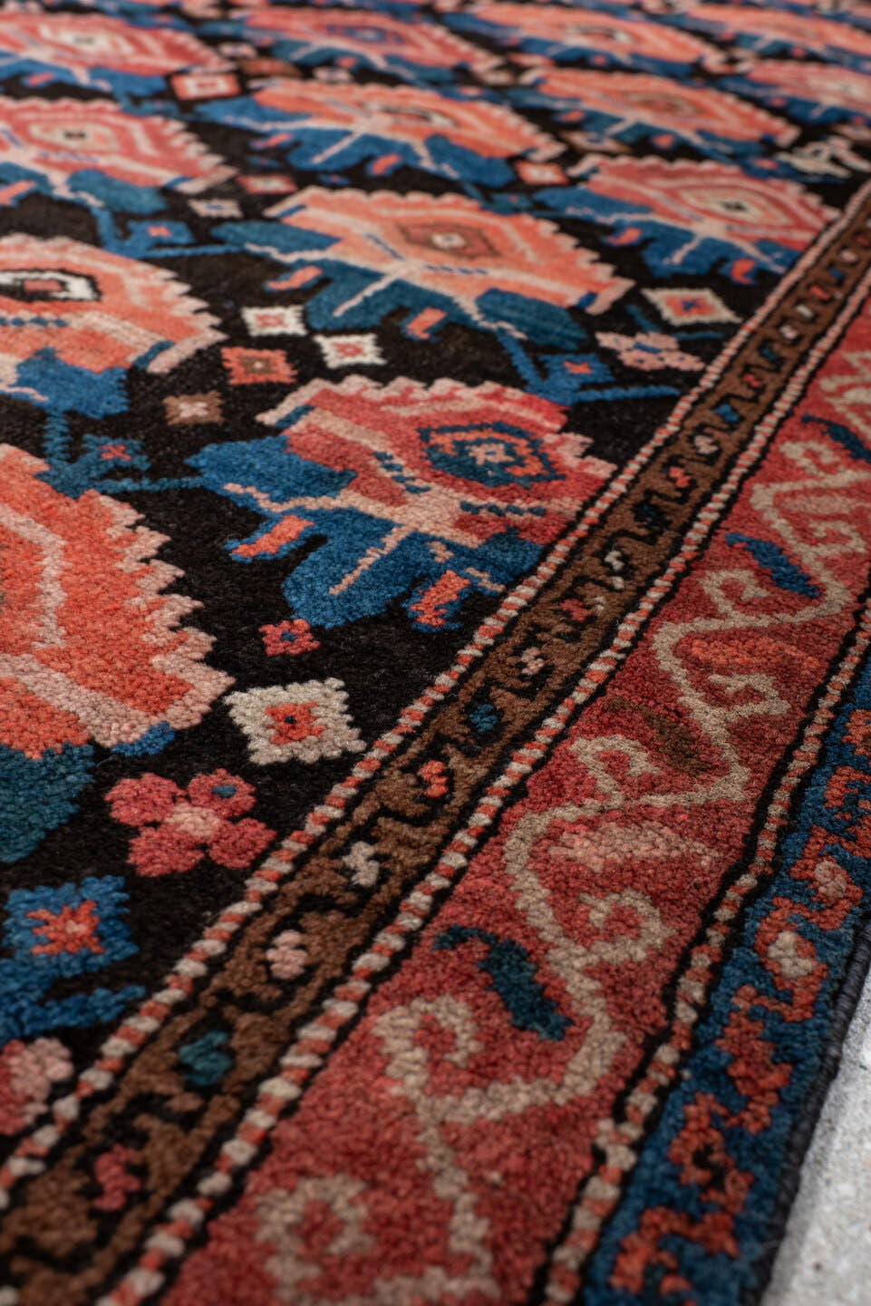 4' x 6' one-of-a-kind handmade vintage Caucasian small size rug. Color palette: rust, charcoal, teal, coral, ivory, navy