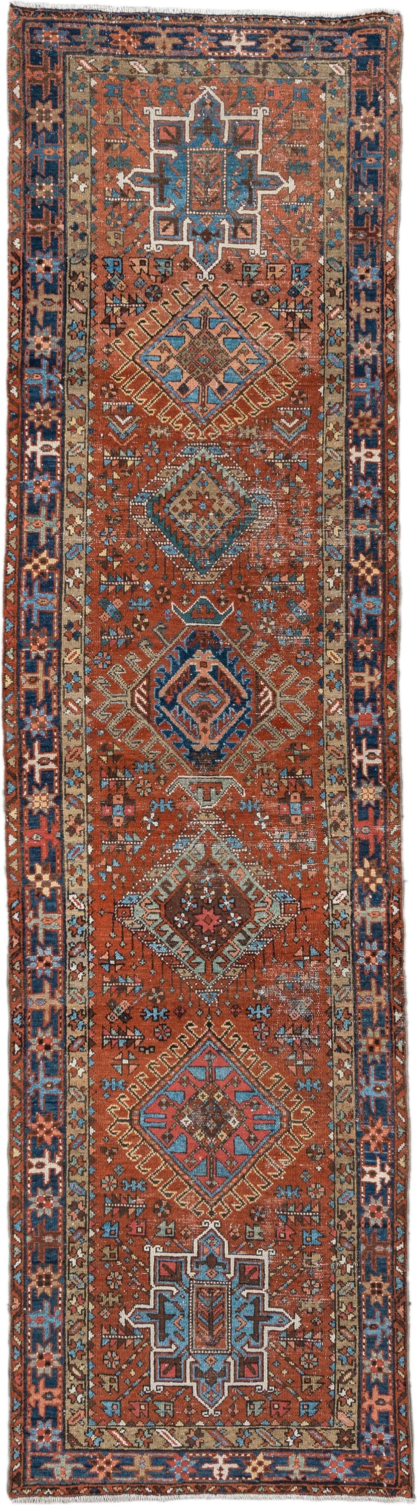 3' x 11' one-of-a-kind handmade vintage Karaje runner rug. Color palette: rust, indigo, sky_blue, ivory, camel, slate, rose