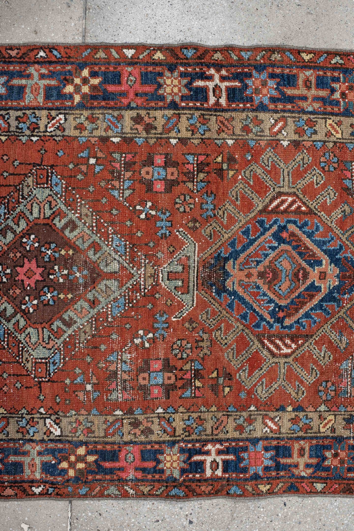 3' x 11' one-of-a-kind handmade vintage Karaje runner rug. Color palette: rust, indigo, sky_blue, ivory, camel, slate, rose