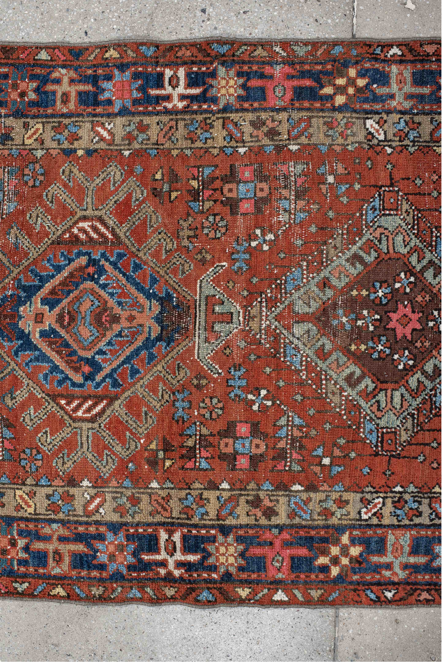 3' x 11' one-of-a-kind handmade vintage Karaje runner rug. Color palette: rust, indigo, sky_blue, ivory, camel, slate, rose
