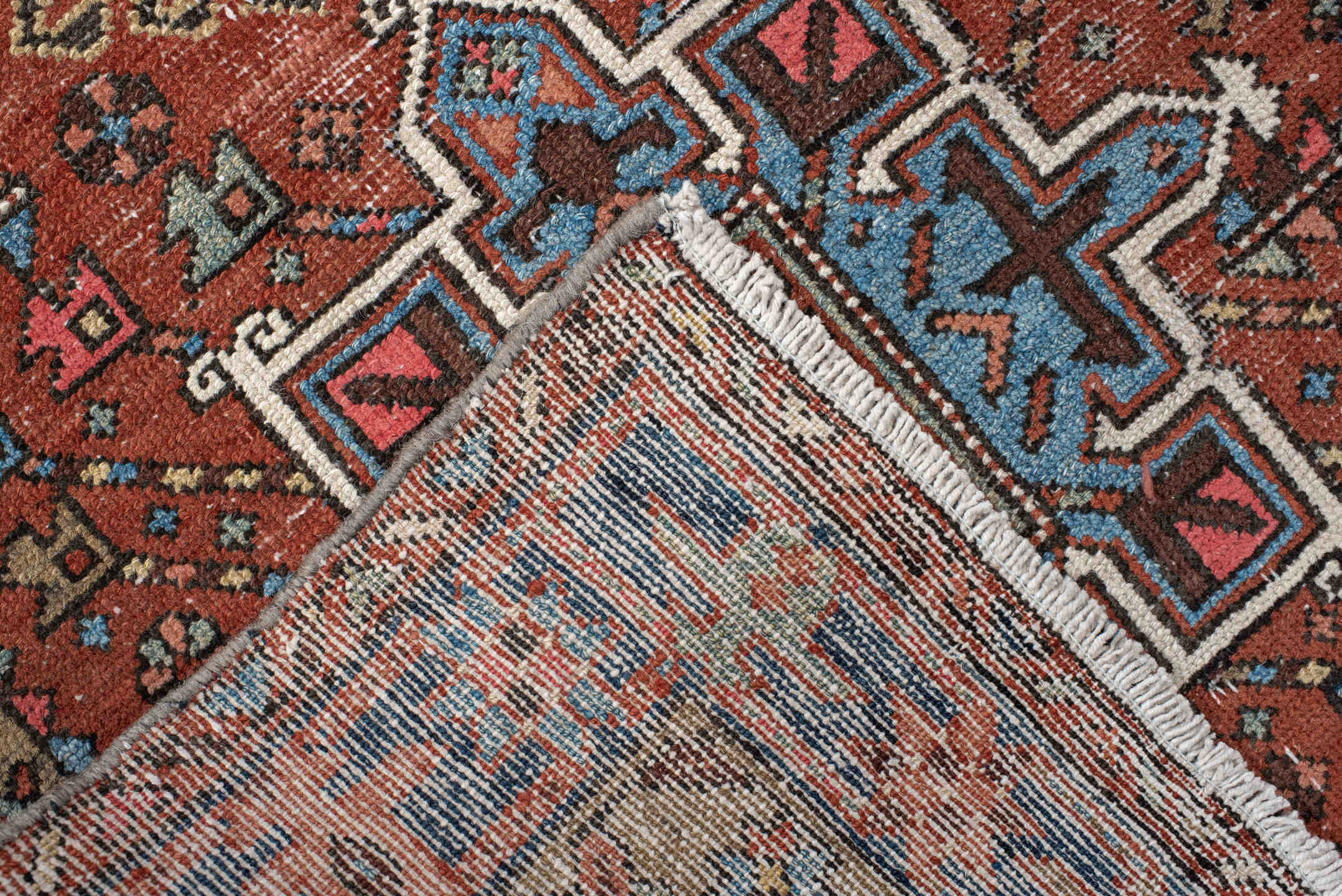 3' x 11' one-of-a-kind handmade vintage Karaje runner rug. Color palette: rust, indigo, sky_blue, ivory, camel, slate, rose