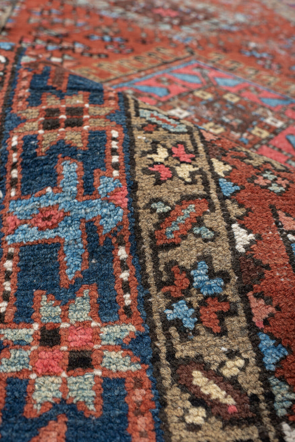 3' x 11' one-of-a-kind handmade vintage Karaje runner rug. Color palette: rust, indigo, sky_blue, ivory, camel, slate, rose