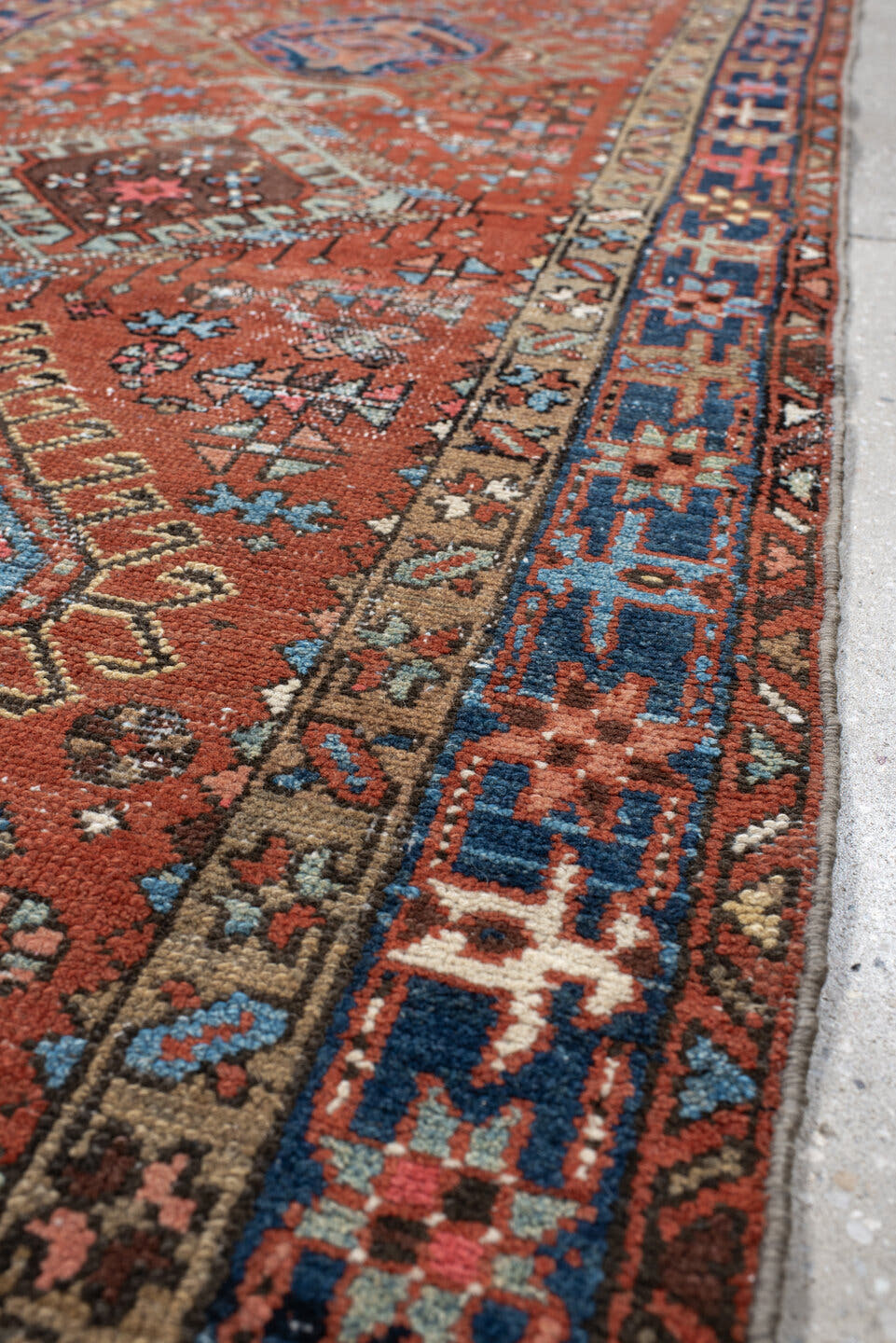 3' x 11' one-of-a-kind handmade vintage Karaje runner rug. Color palette: rust, indigo, sky_blue, ivory, camel, slate, rose