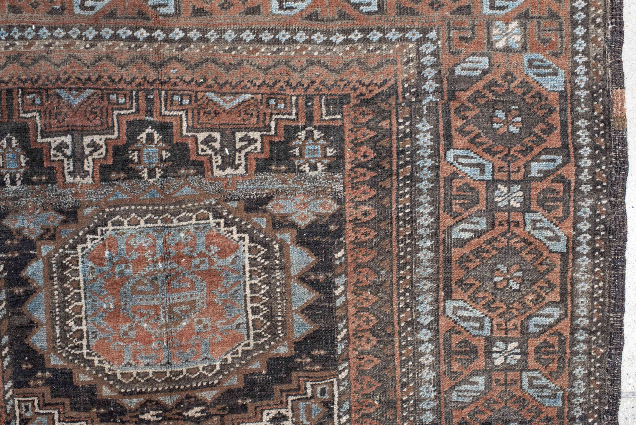 3' x 5' one-of-a-kind handmade antique Belouch small size rug. Color palette: brown, charcoal, rust, sky blue, ivory, taupe