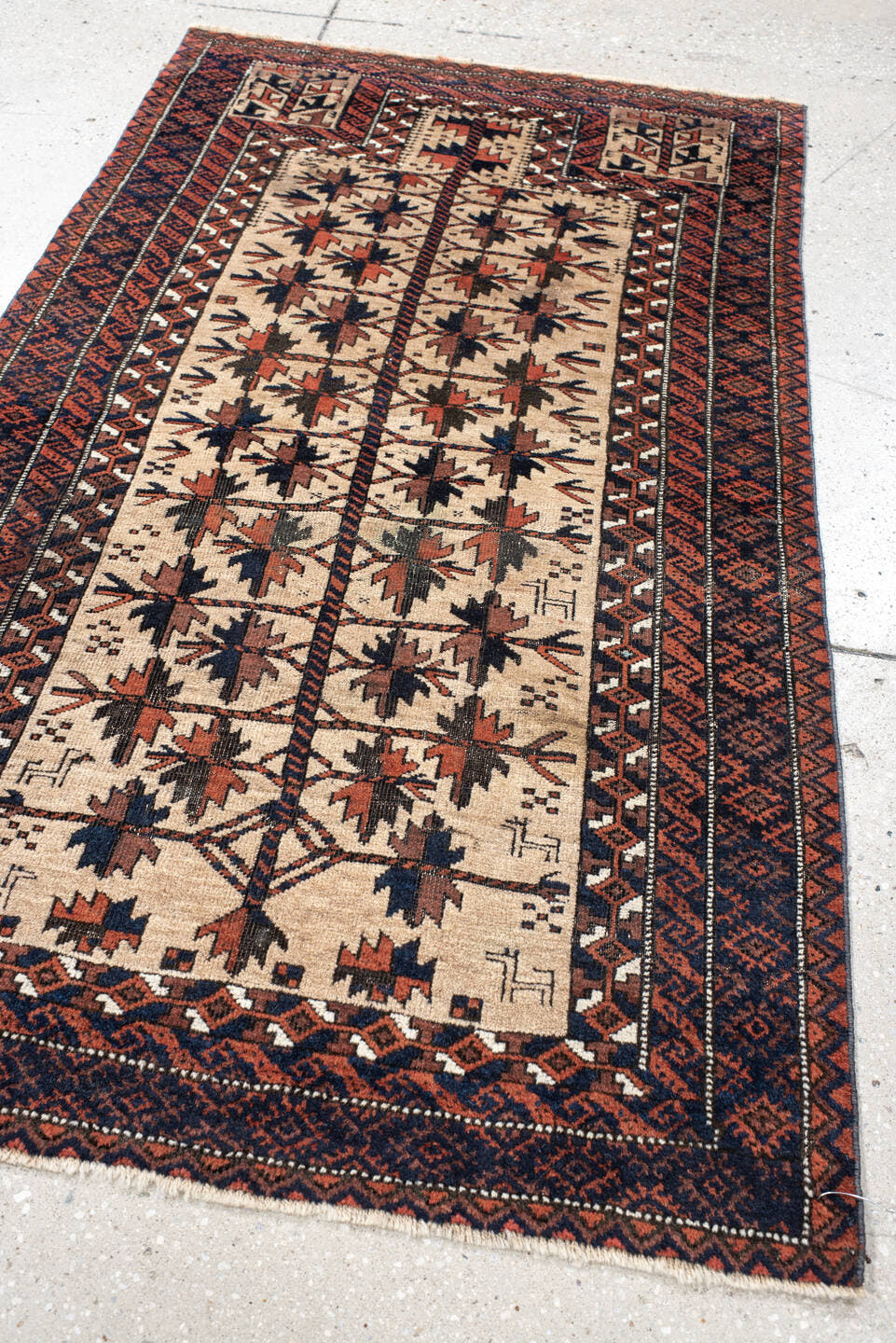 2' x 4' one-of-a-kind handmade vintage Belouch small size rug. Color palette: ivory, rust, navy, camel, brown, terracotta