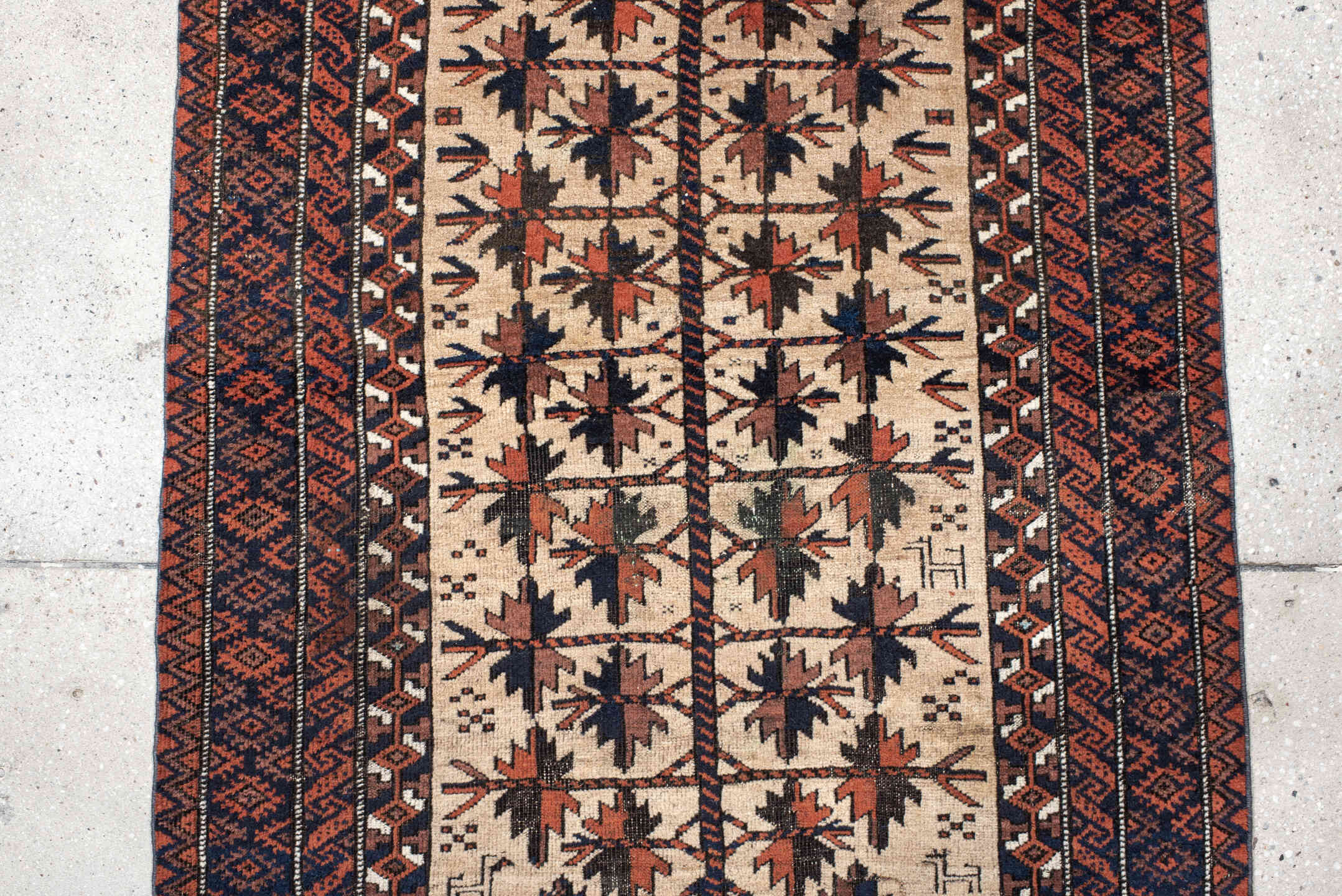 2' x 4' one-of-a-kind handmade vintage Belouch small size rug. Color palette: ivory, rust, navy, camel, brown, terracotta