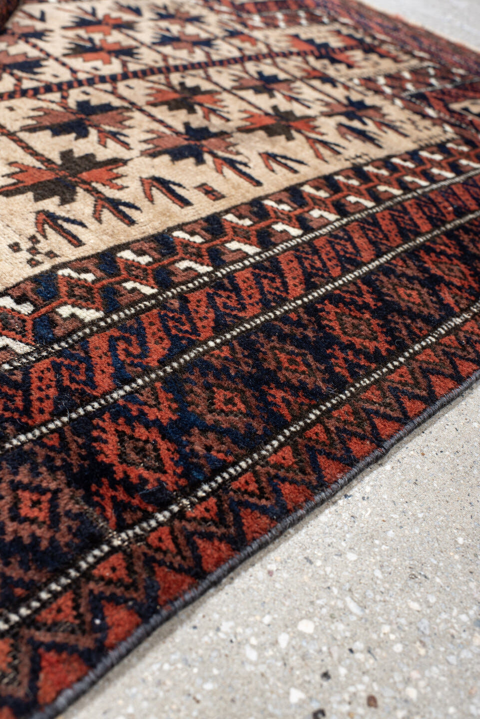 2' x 4' one-of-a-kind handmade vintage Belouch small size rug. Color palette: ivory, rust, navy, camel, brown, terracotta