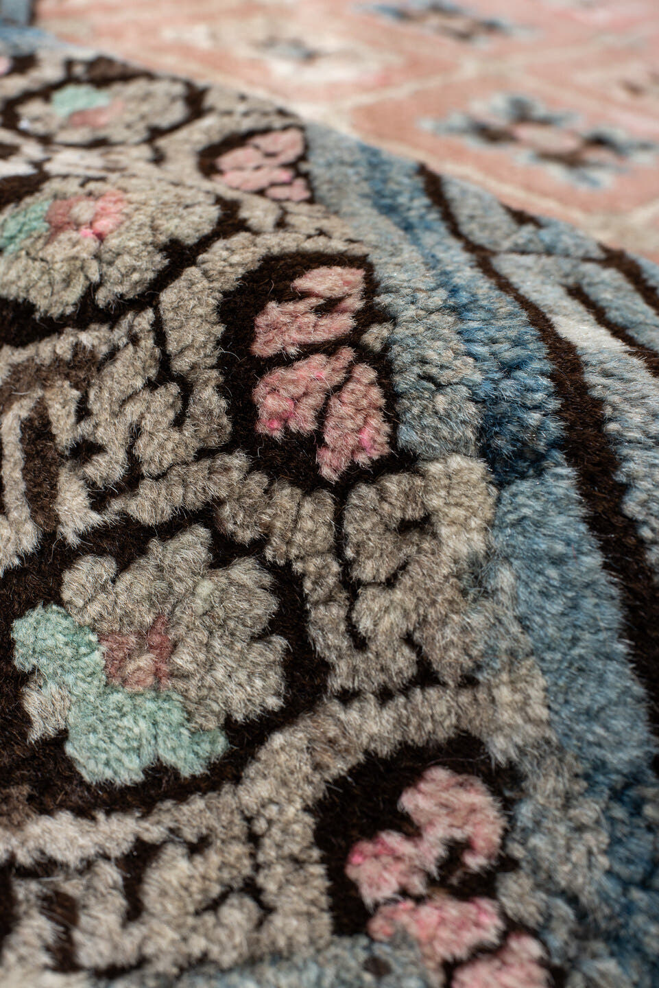4' x 7' one-of-a-kind handmade vintage Tibetan rug. Color palette: salmon, charcoal, sky blue, ivory, rose, taupe, brown
