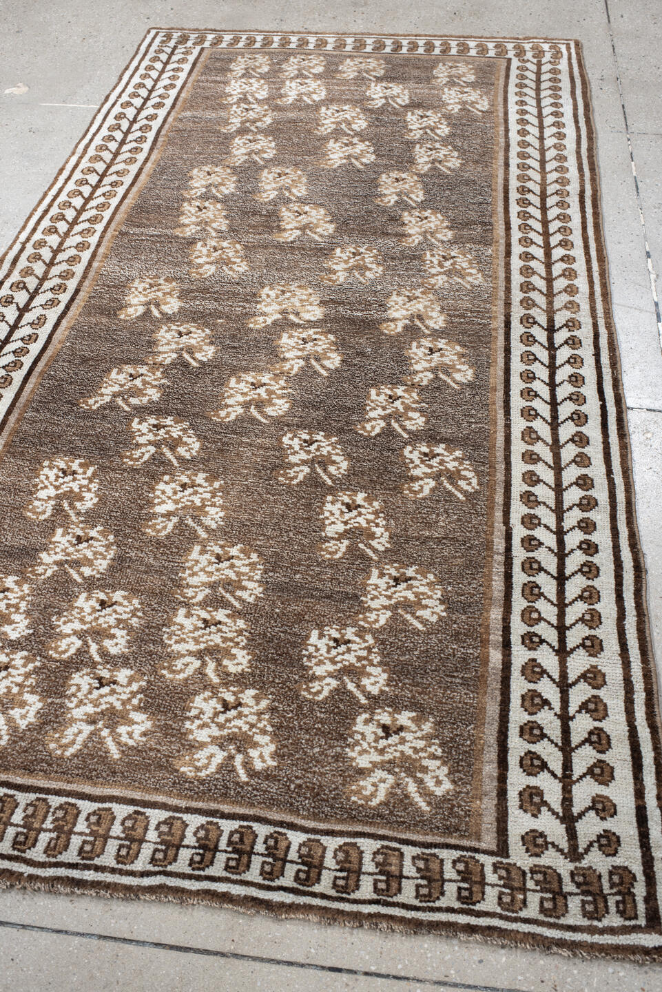 4' x 7' one-of-a-kind handmade vintage Gabbe rug. Color palette: brown, gray, light gray, off-white, orange, pink, silver