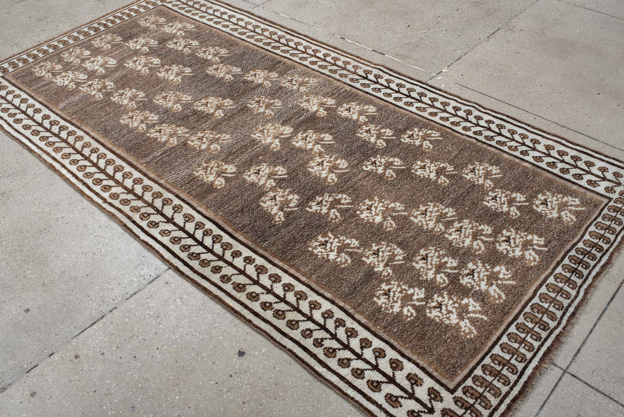 4' x 7' one-of-a-kind handmade vintage Gabbe rug. Color palette: brown, gray, light gray, off-white, orange, pink, silver