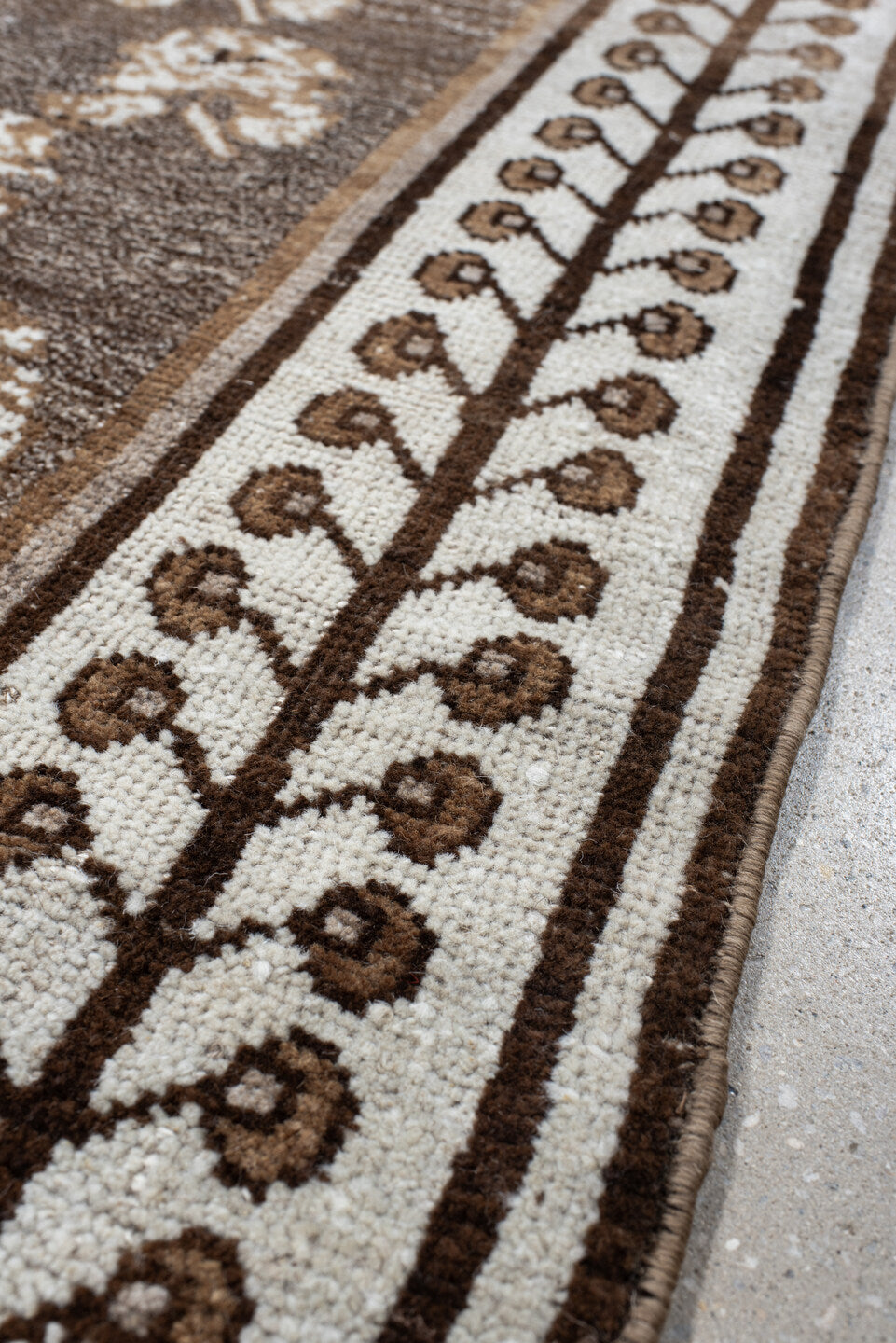 4' x 7' one-of-a-kind handmade vintage Gabbe rug. Color palette: brown, gray, light gray, off-white, orange, pink, silver