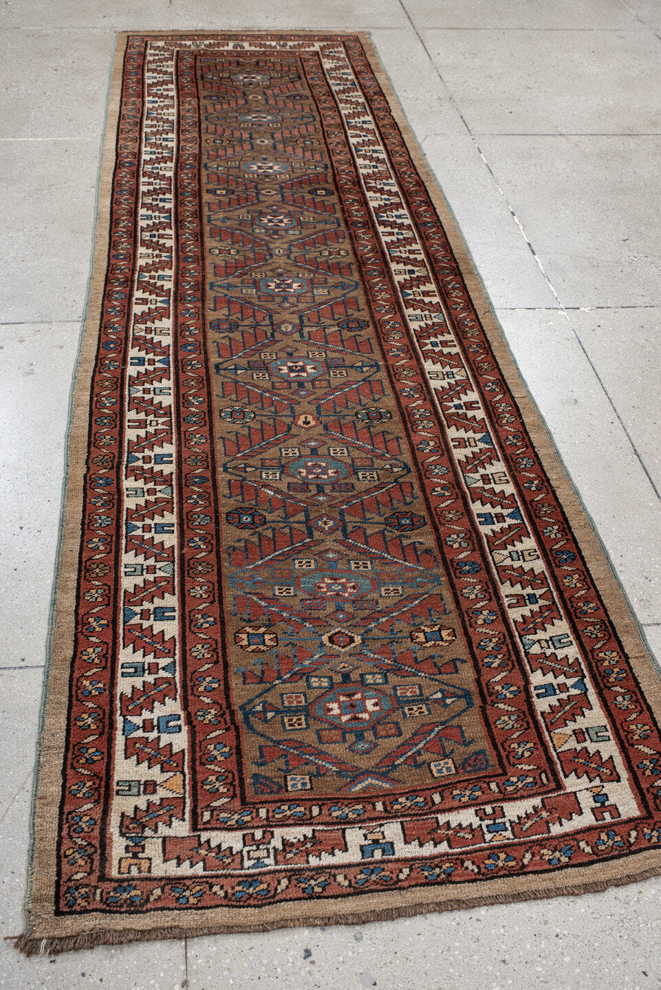 3' x 10' one-of-a-kind handmade vintage NW Persian runner rug. Color palette: camel, rust, ivory, indigo, terra cotta, brown