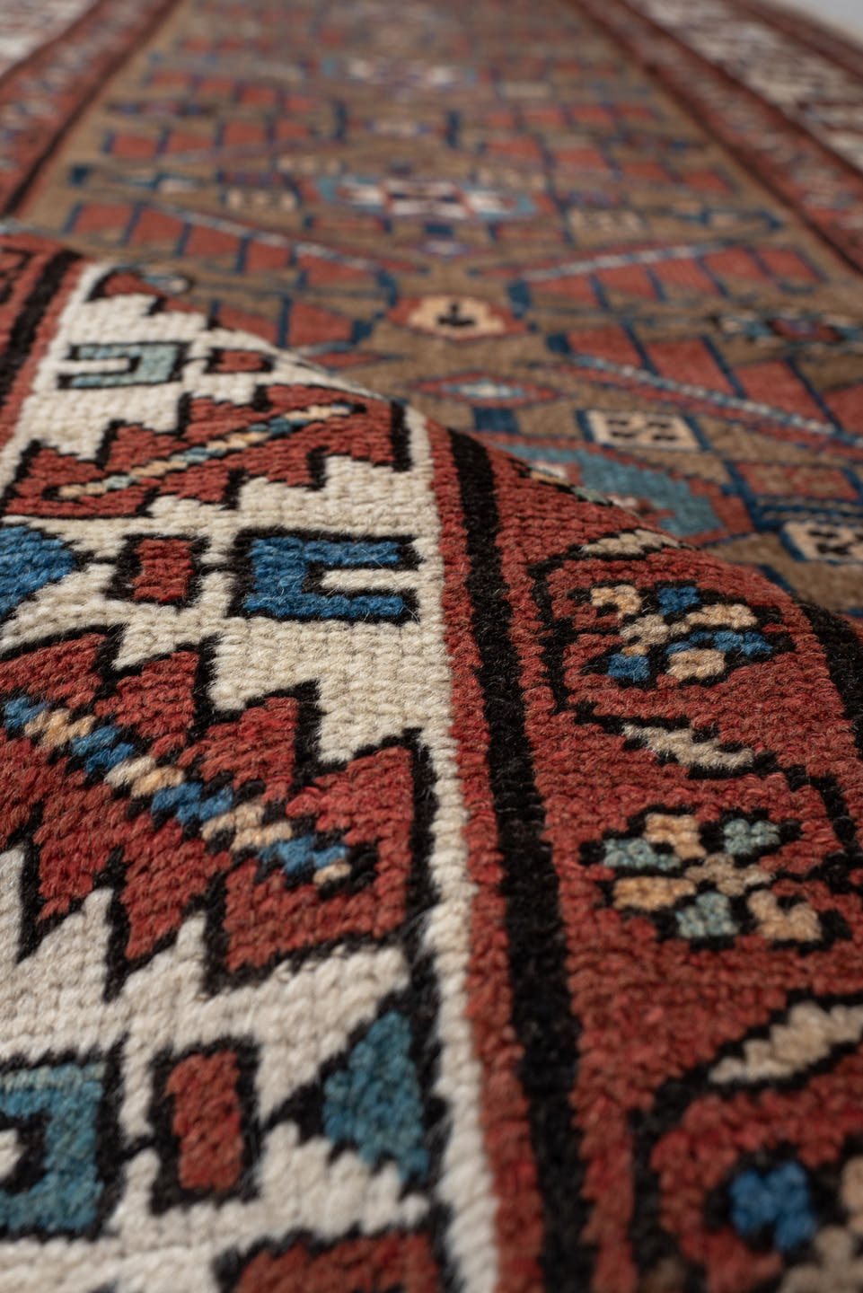 3' x 10' one-of-a-kind handmade vintage NW Persian runner rug. Color palette: camel, rust, ivory, indigo, terra cotta, brown