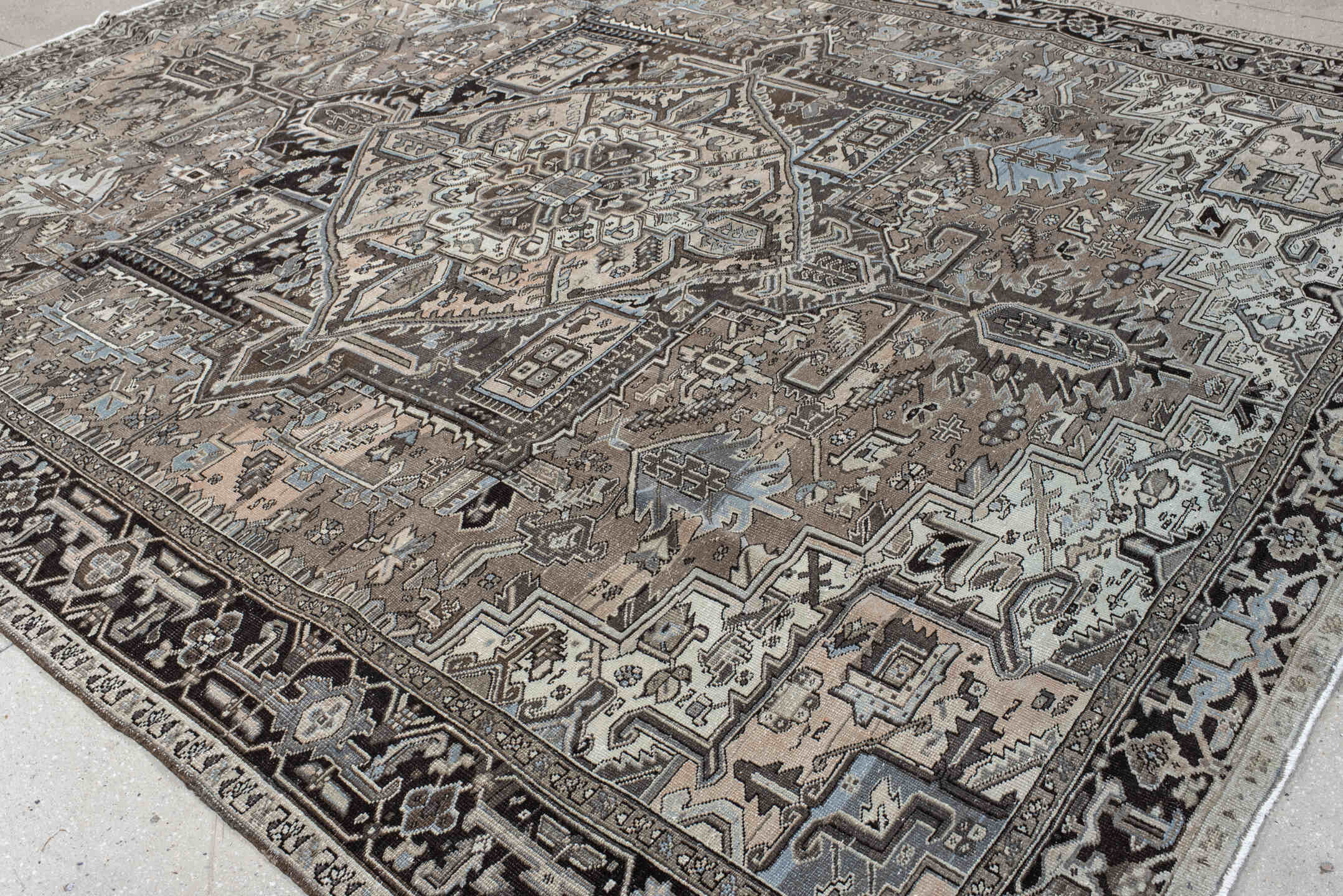 9' x 12' one-of-a-kind handmade antique Heriz large size rug. Color palette: taupe, charcoal, ivory, pale blue, brown, slate