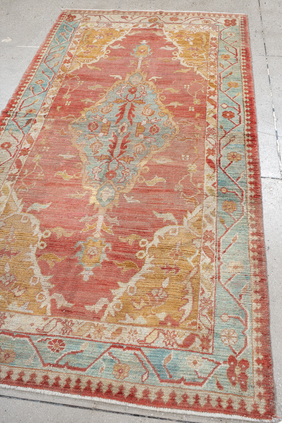4' x 7' one-of-a-kind handmade vintage Oushak rug. Color palette: rose, aqua, ivory, peach, rust, gold, beige, pink, red