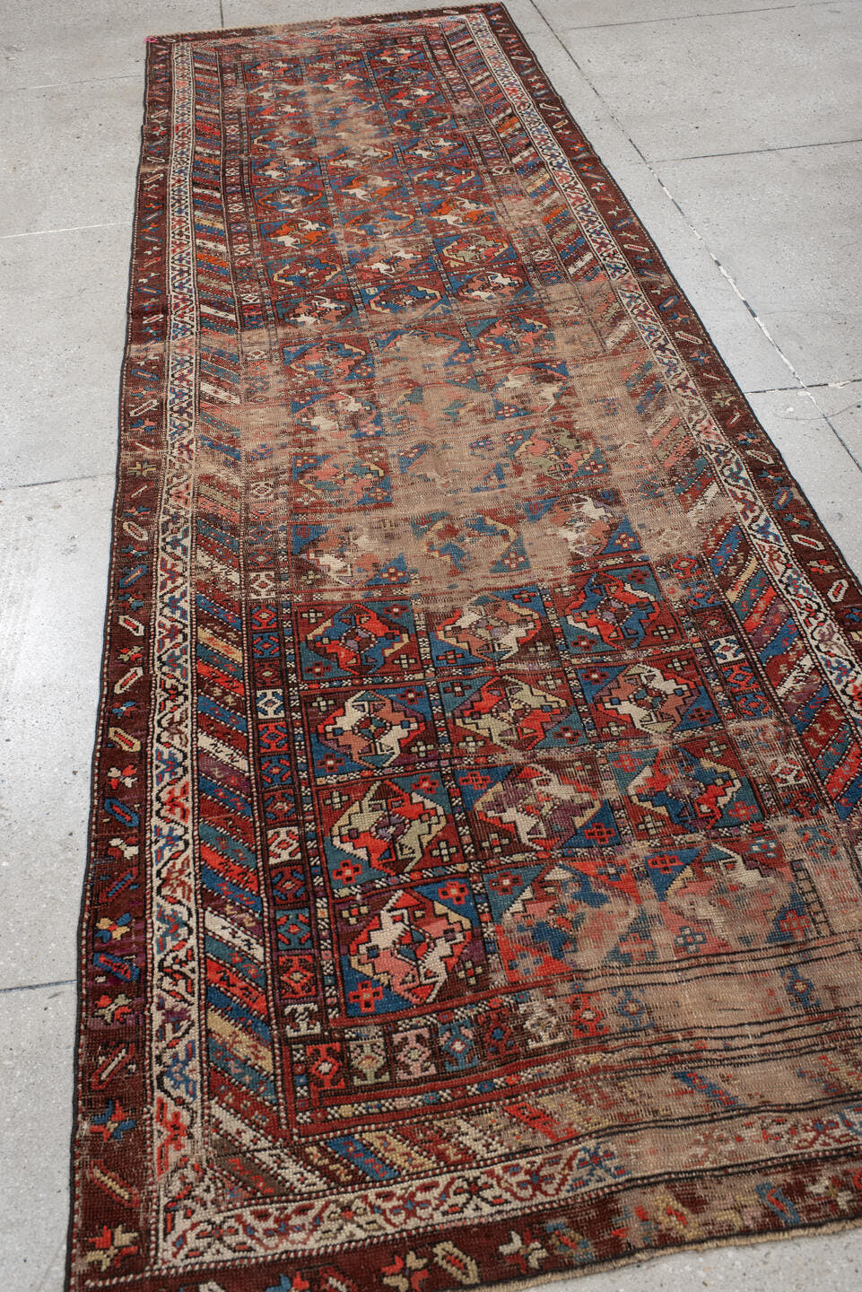 3' x 11' one-of-a-kind handmade antique Varamin runner rug. Color palette: brown, camel, indigo, rust, ivory, terra cotta