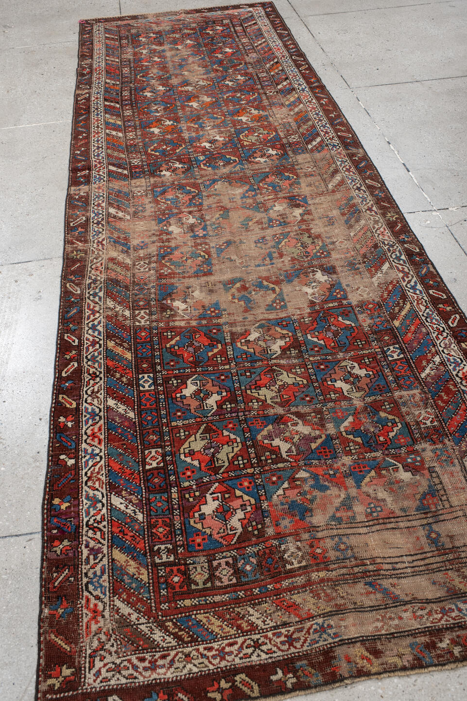 3' x 11' one-of-a-kind handmade antique Varamin runner rug. Color palette: brown, camel, indigo, rust, ivory, terra cotta