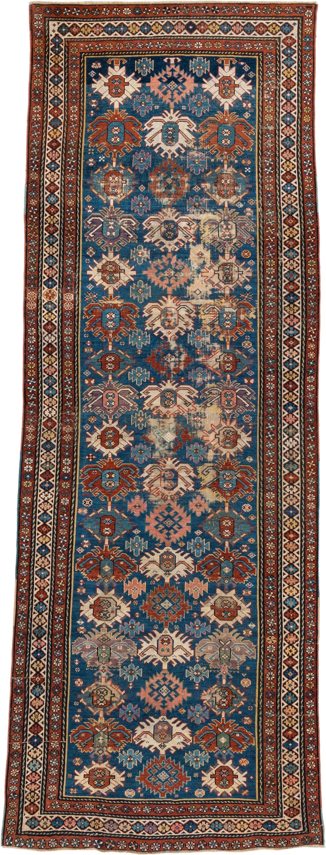 4' x 11' one-of-a-kind handmade vintage Caucasian runner rug. Color palette: blue, rust, ivory, indigo, terra cotta, camel