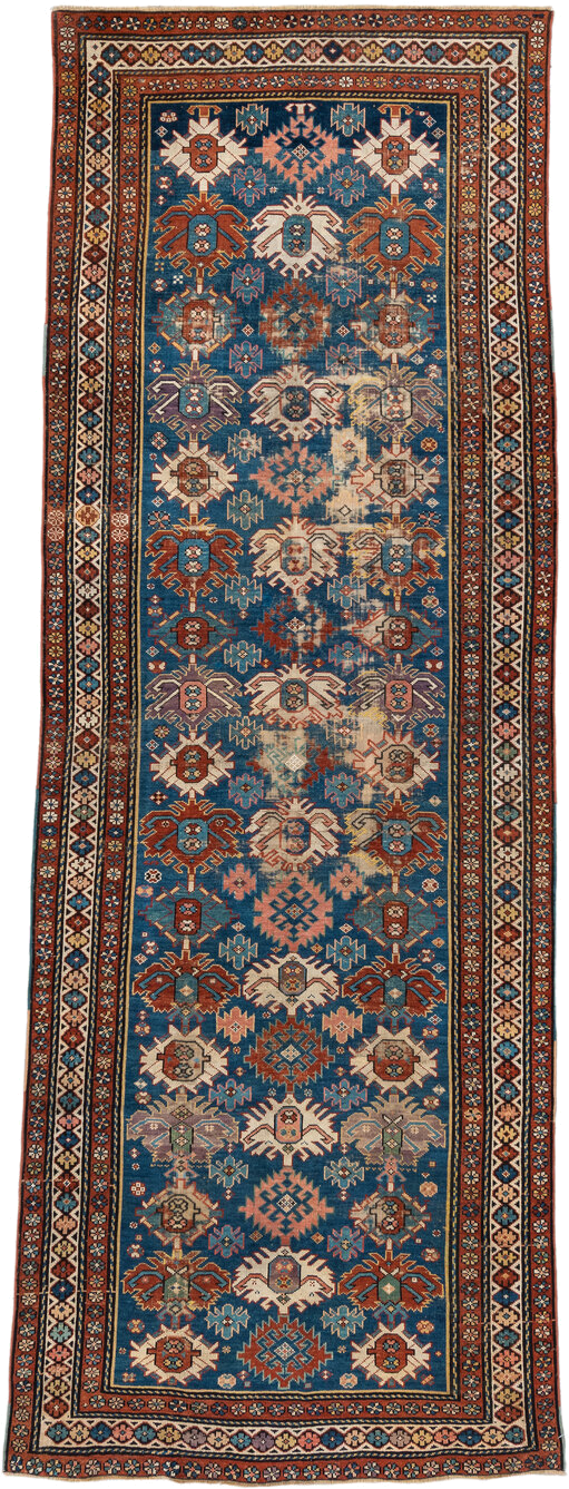 4' x 11' one-of-a-kind handmade vintage Caucasian runner rug. Color palette: blue, rust, ivory, indigo, terra cotta, camel