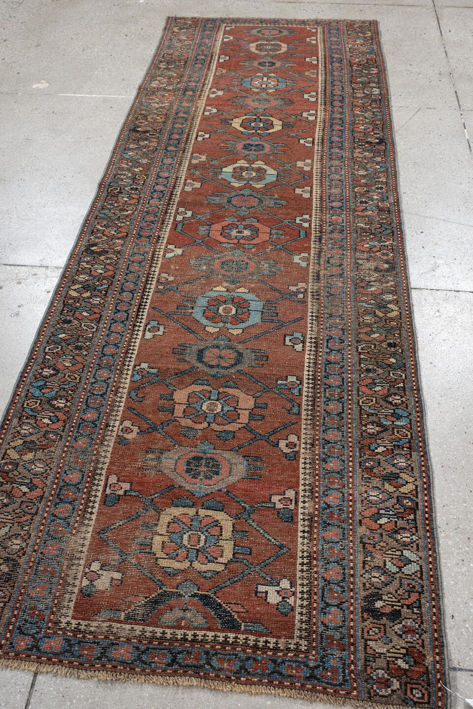 3' x 9' one-of-a-kind handmade vintage NW Persian runner rug. Color palette: rust, blue, ivory, navy, camel, taupe, charcoal
