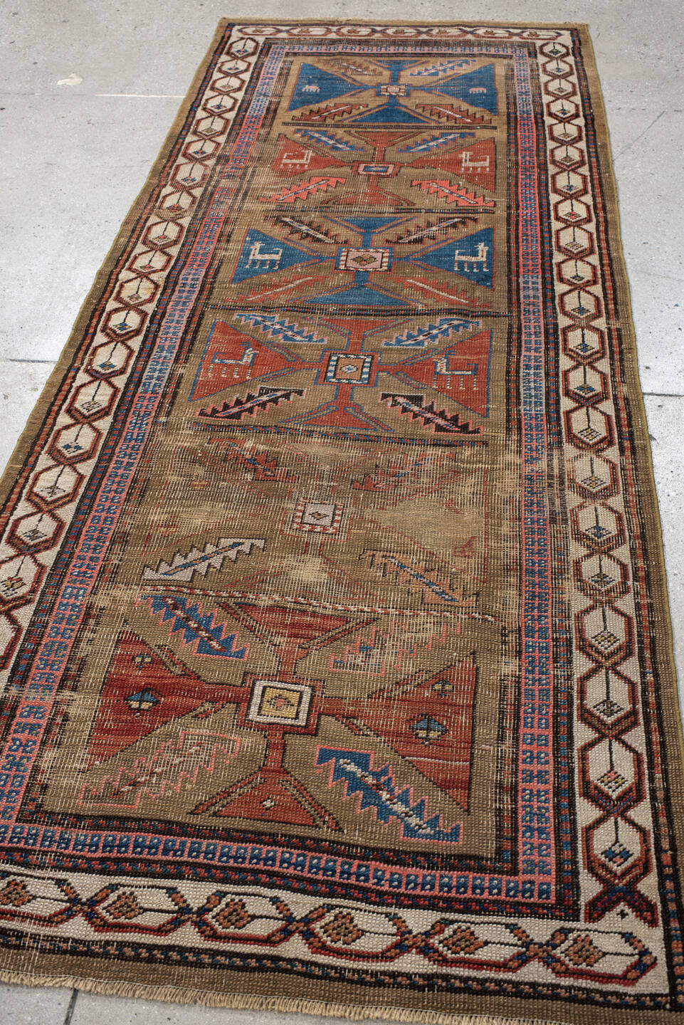 3' x 7' one-of-a-kind handmade vintage Sarab runner rug. Color palette: taupe, camel, indigo, rust, ivory, brown, terracotta