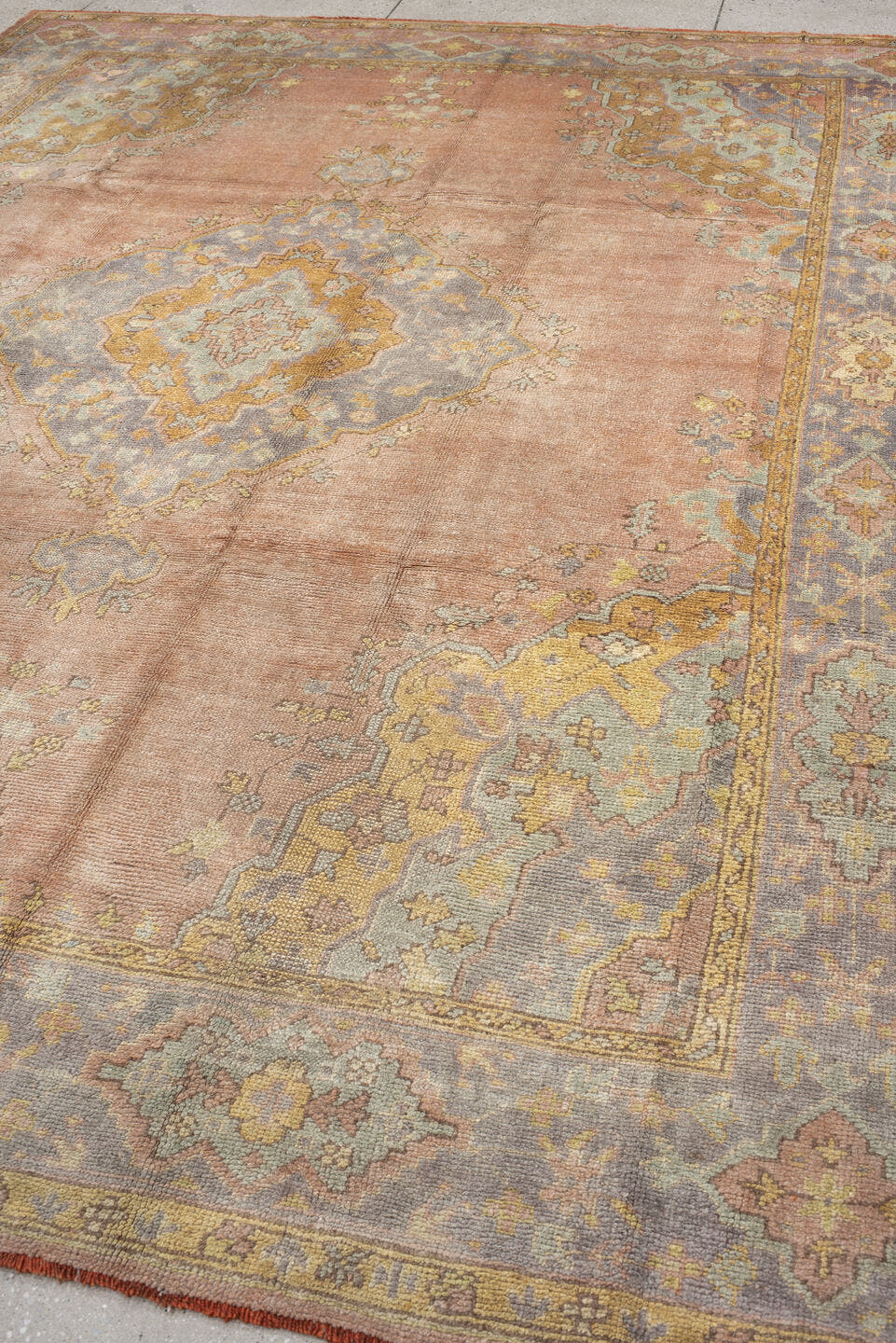 8' x 11' one-of-a-kind handmade antique Oushak large size rug. Color palette: blush, powder blue, gold, ivory, sage, peach