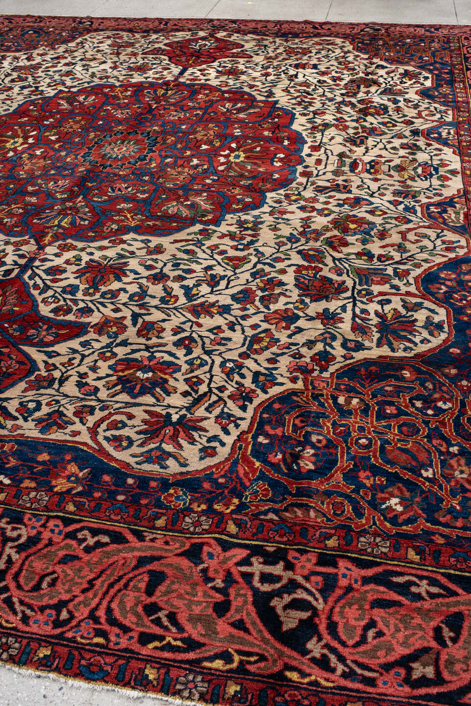 14' x 16' one-of-a-kind handmade vintage Baktiary oversize rug. Color palette: ivory, rust, navy, terracotta, indigo, rose