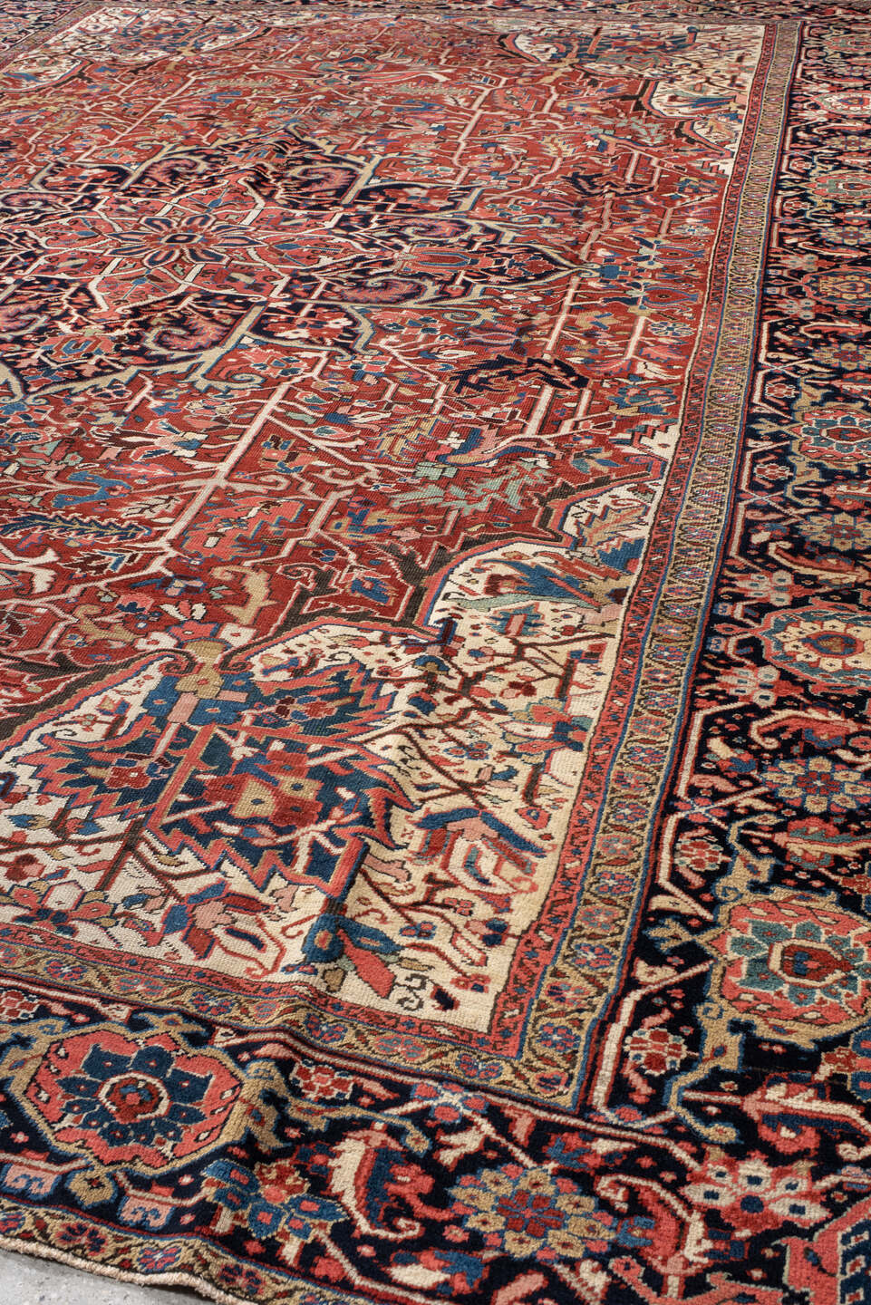 11' x 15' one-of-a-kind handmade vintage Heriz oversize rug. Color palette: rust, ivory, navy, sky_blue, rose, teal