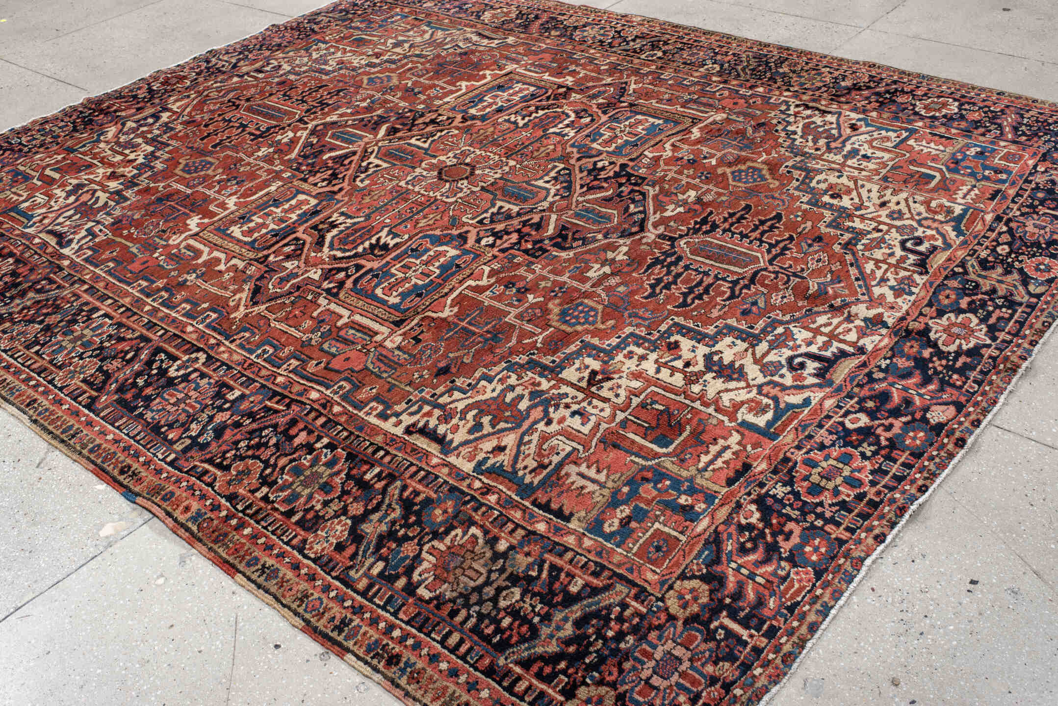 9' x 10' one-of-a-kind handmade antique Heriz large size rug. Color palette: rust, navy, ivory, sky_blue, crimson, camel