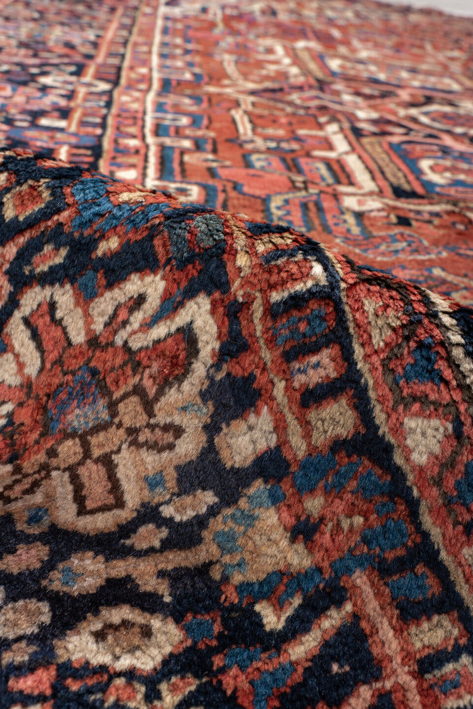9' x 10' one-of-a-kind handmade antique Heriz large size rug. Color palette: rust, navy, ivory, sky_blue, crimson, camel