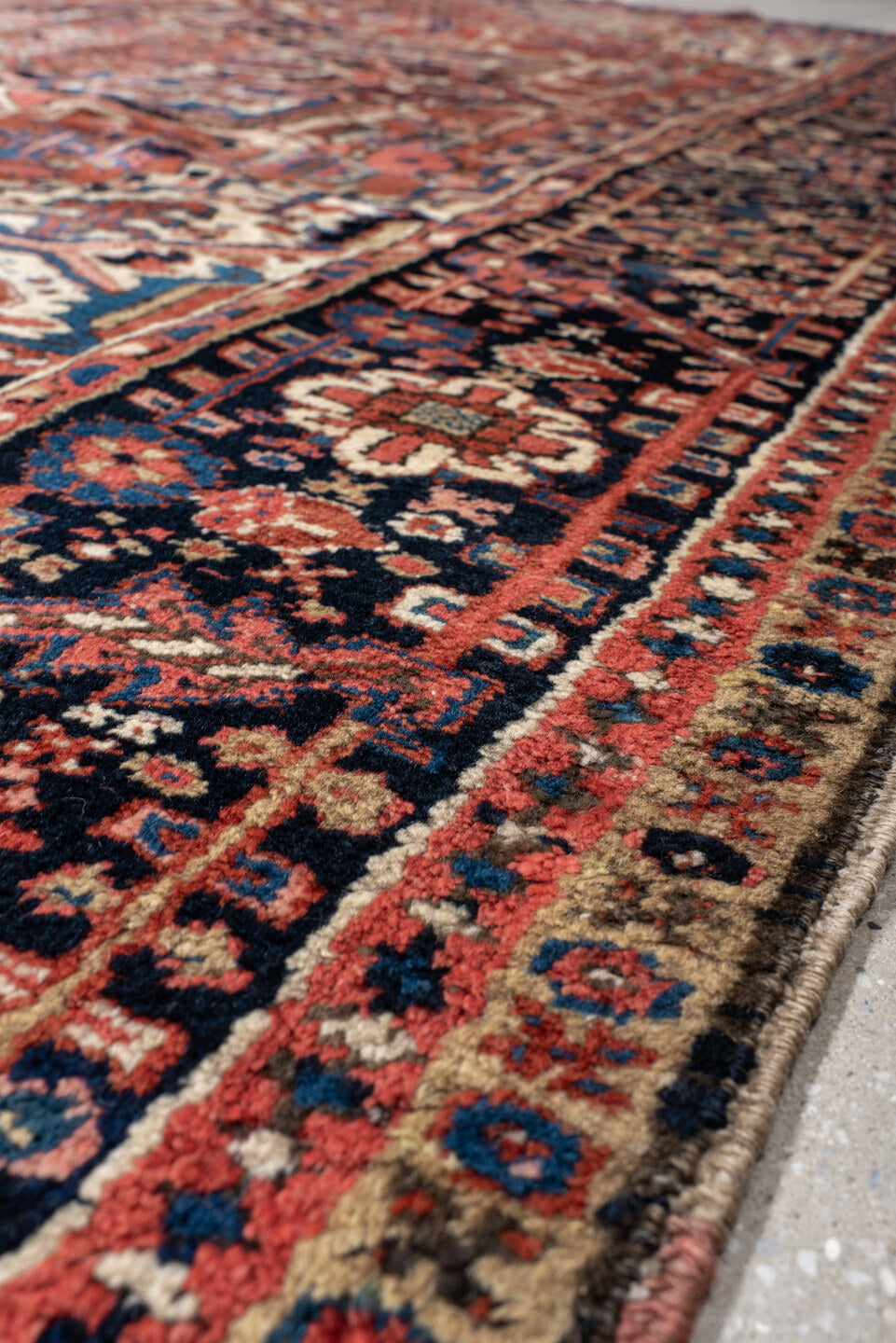 9' x 10' one-of-a-kind handmade antique Heriz large size rug. Color palette: rust, navy, ivory, sky_blue, crimson, camel