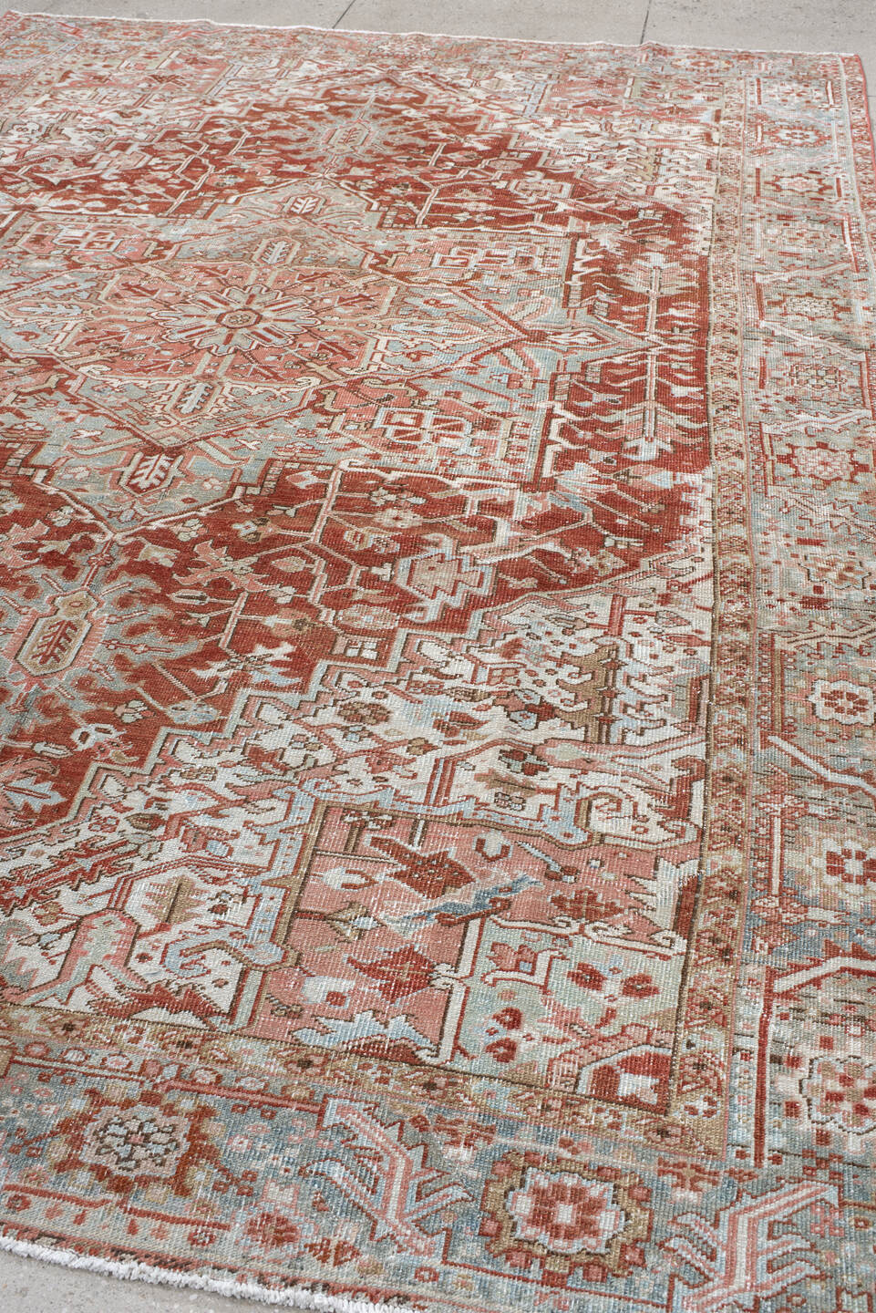 8' x 11' one-of-a-kind handmade vintage Heriz large size rug. Color palette: rust, pale blue, ivory, terra cotta, taupe