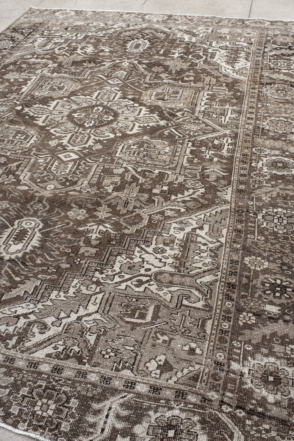 7' x 10' one-of-a-kind handmade antique Heriz large size rug. Color palette: taupe, brown, ivory, charcoal, camel, beige
