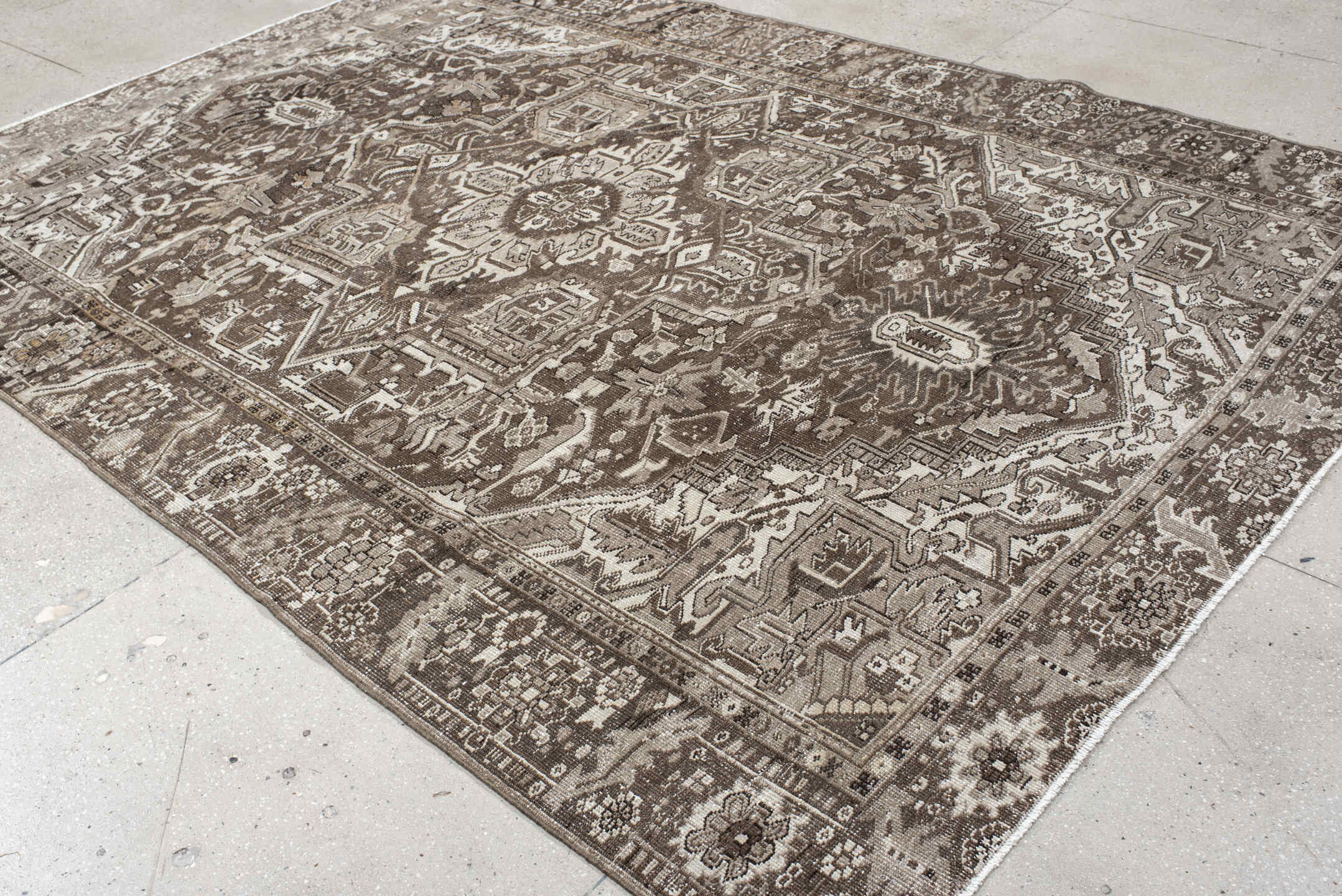 7' x 10' one-of-a-kind handmade antique Heriz large size rug. Color palette: taupe, brown, ivory, charcoal, camel, beige