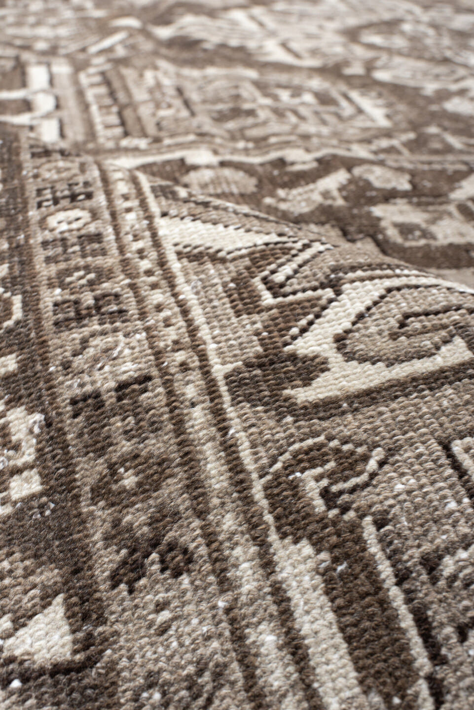 7' x 10' one-of-a-kind handmade antique Heriz large size rug. Color palette: taupe, brown, ivory, charcoal, camel, beige