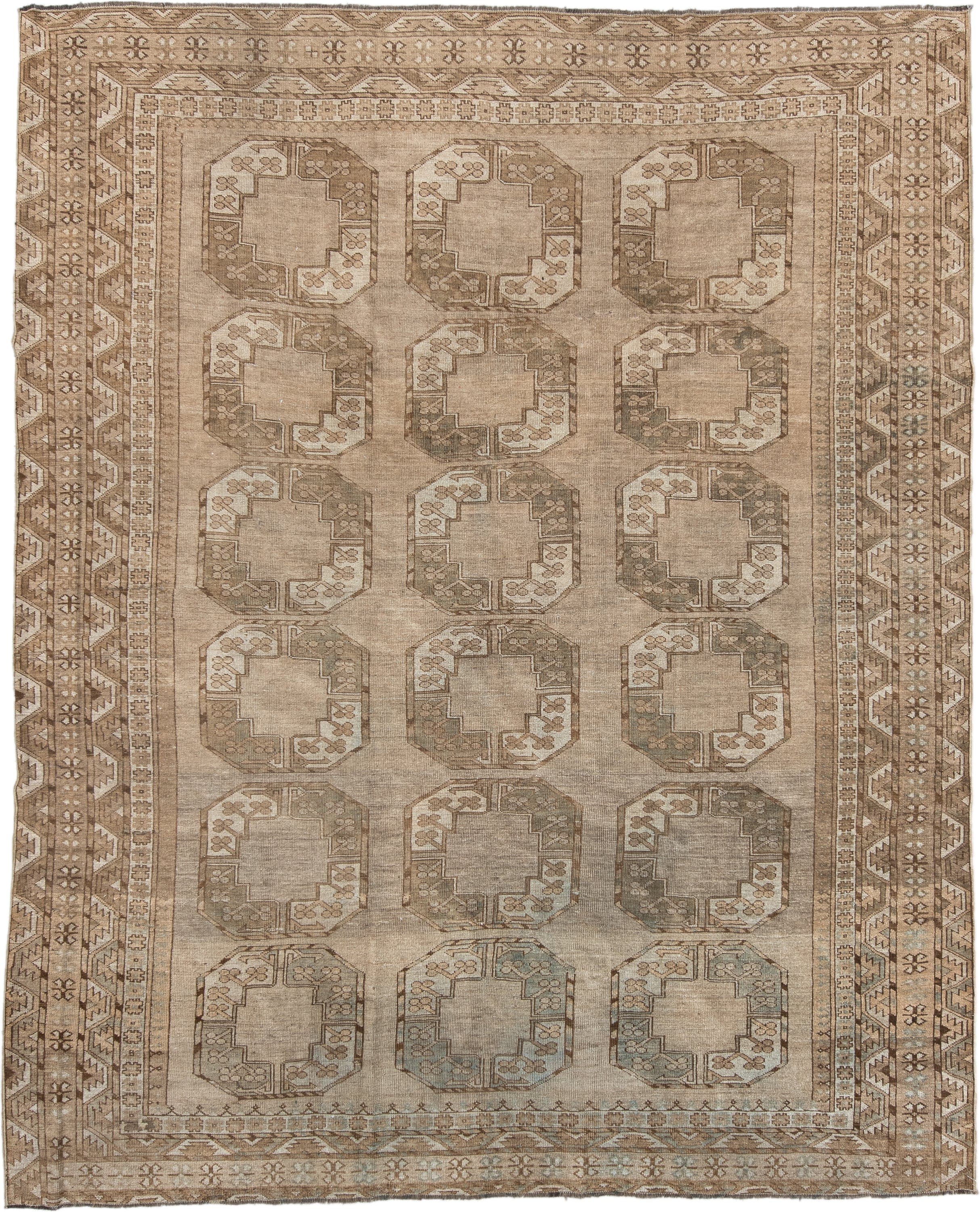 7' x 9' one-of-a-kind handmade antique Afghan rug. Color palette: taupe, camel, beige, ivory, sand, light brown, pale blue