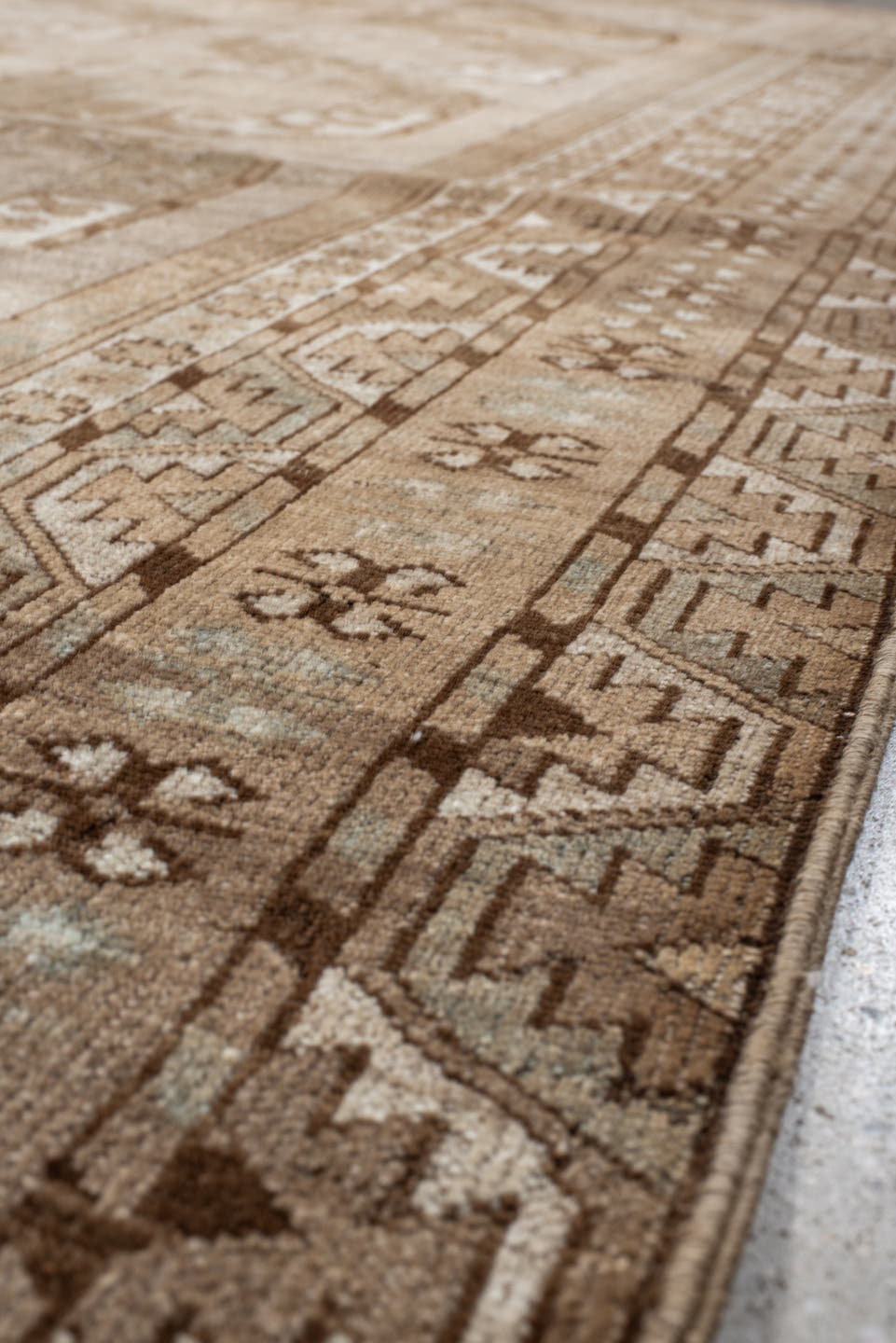 7' x 9' one-of-a-kind handmade antique Afghan rug. Color palette: taupe, camel, beige, ivory, sand, light brown, pale blue